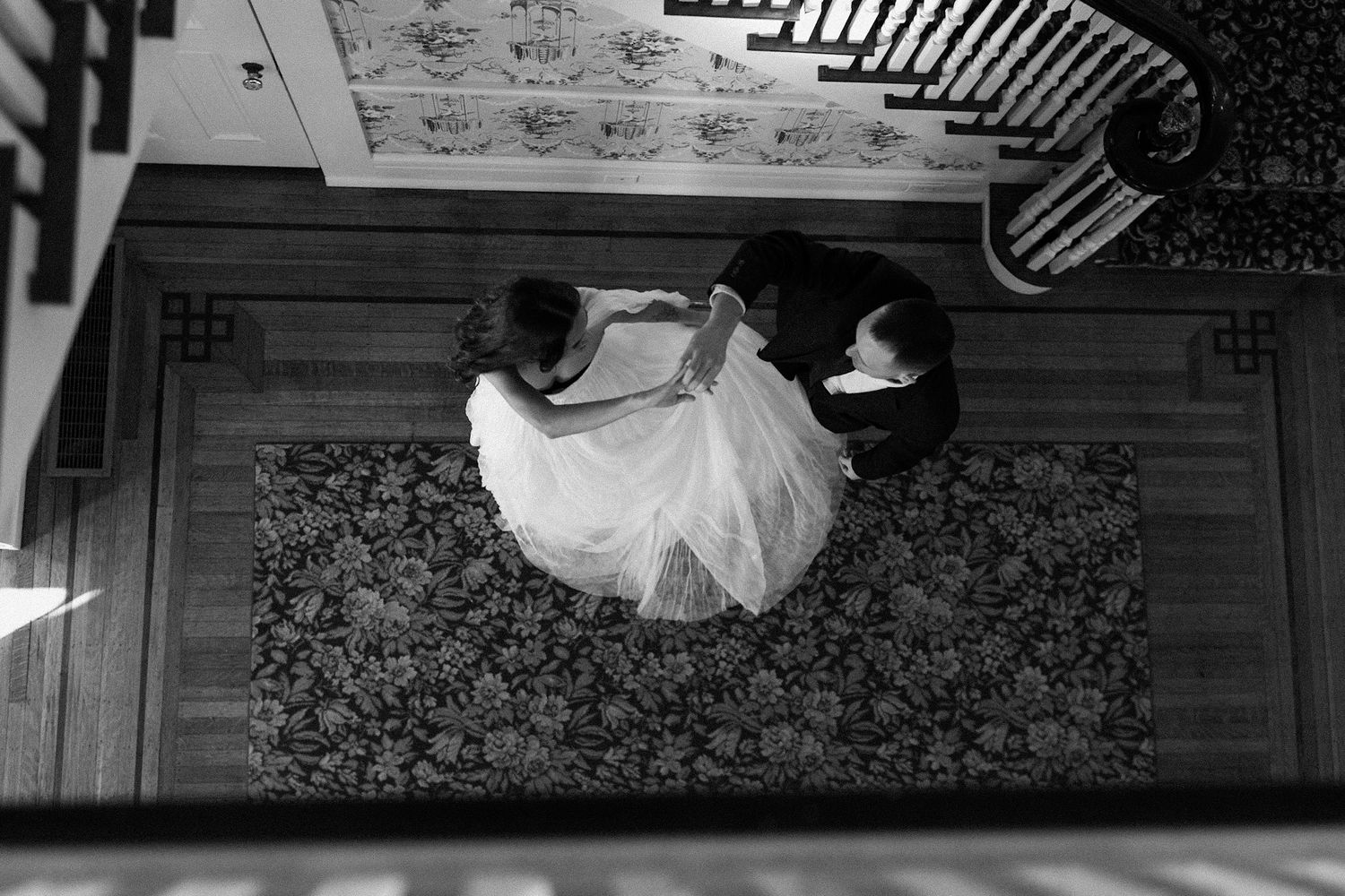 Black and white wedding photos showing romantic moments and dance sequences.