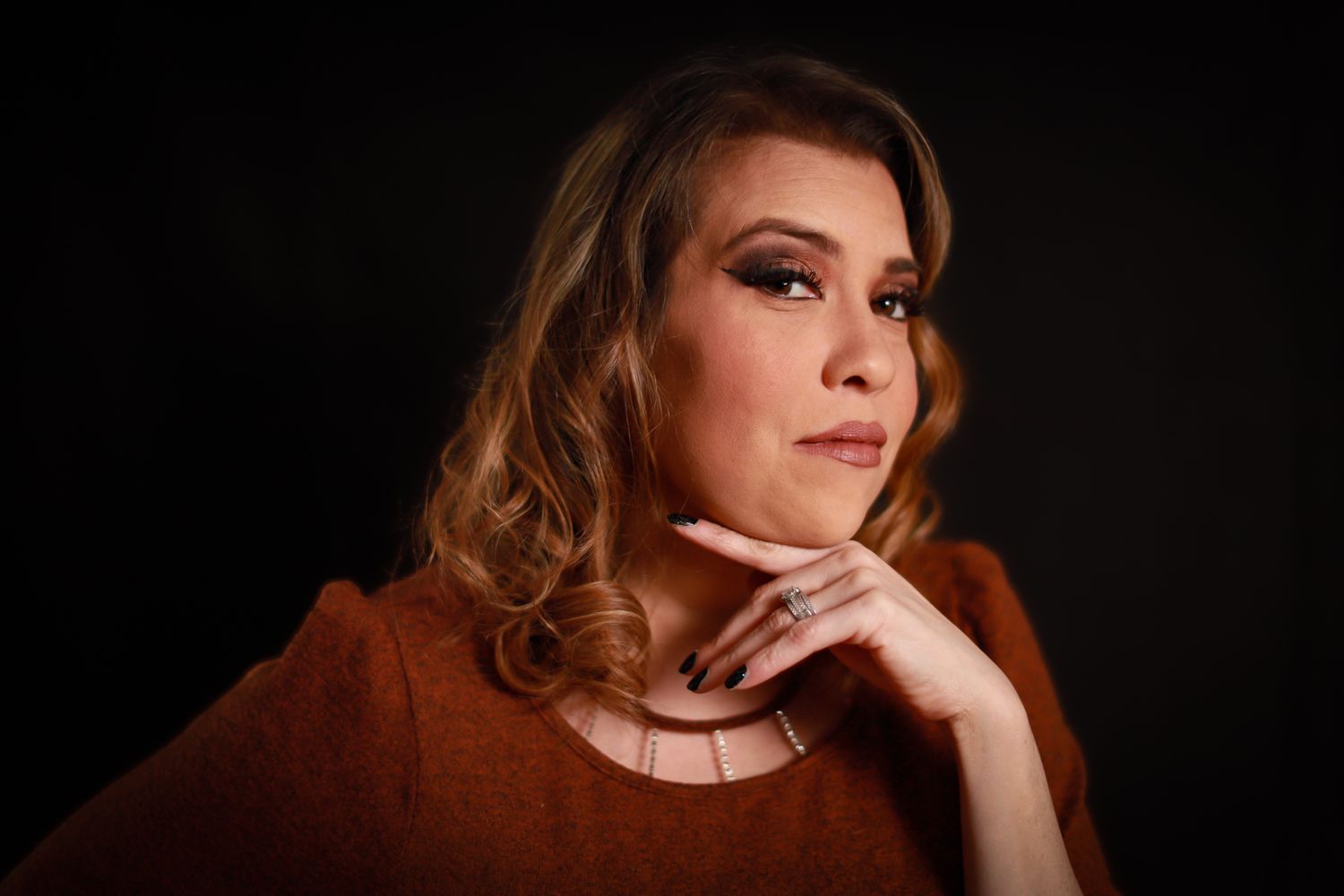 Burnette portrait with smokey brown makeup glam