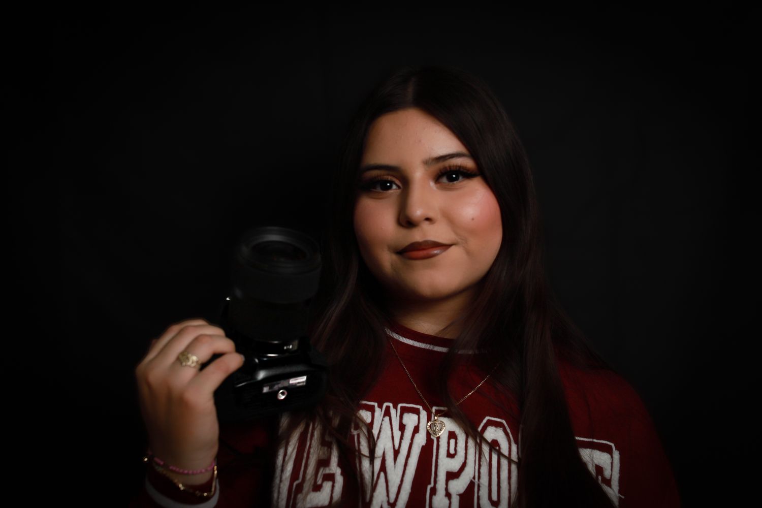 Teenage girl with camera portrait