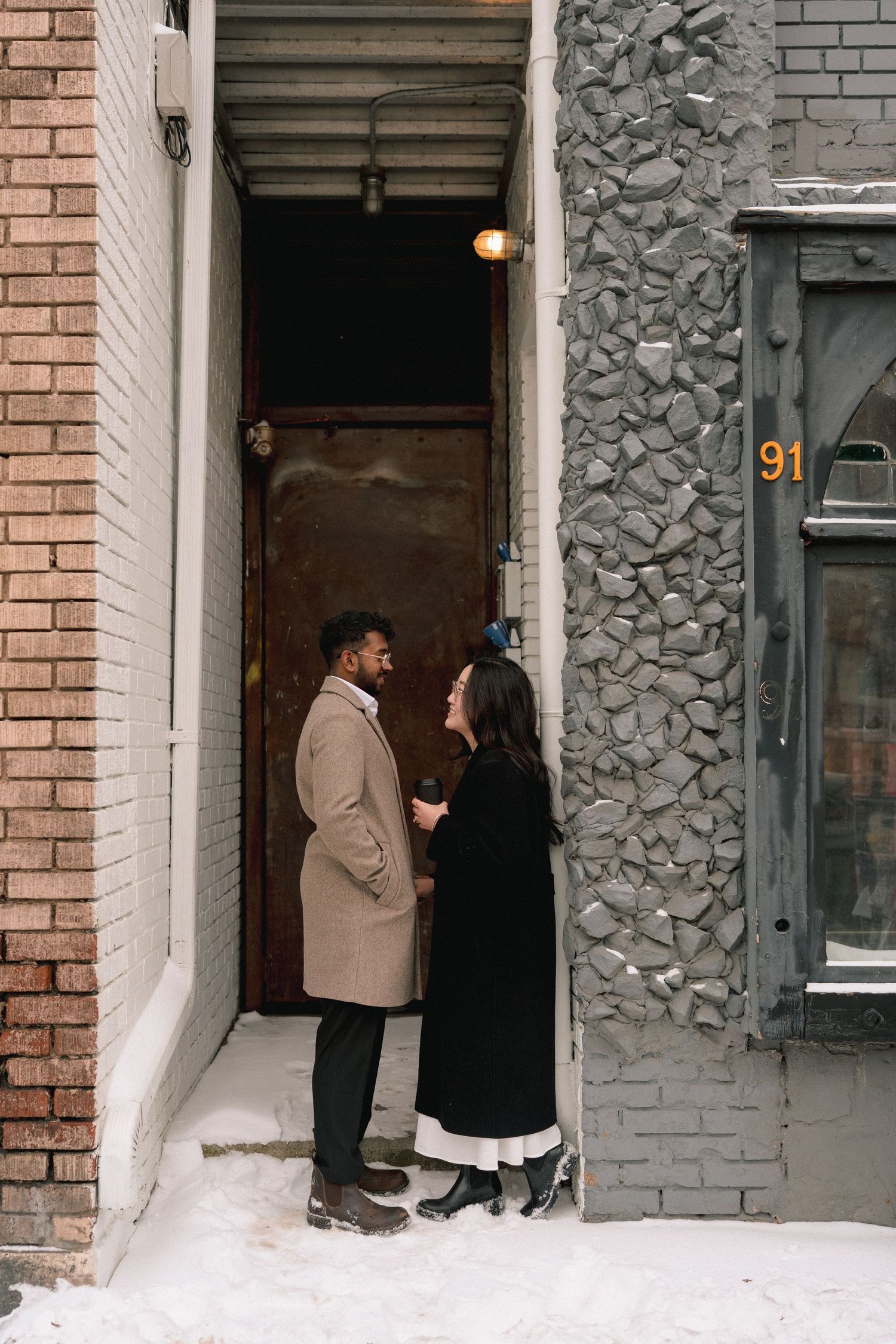 Multiple sequential photos show people interacting near a brick building entrance in snowy winter conditions.