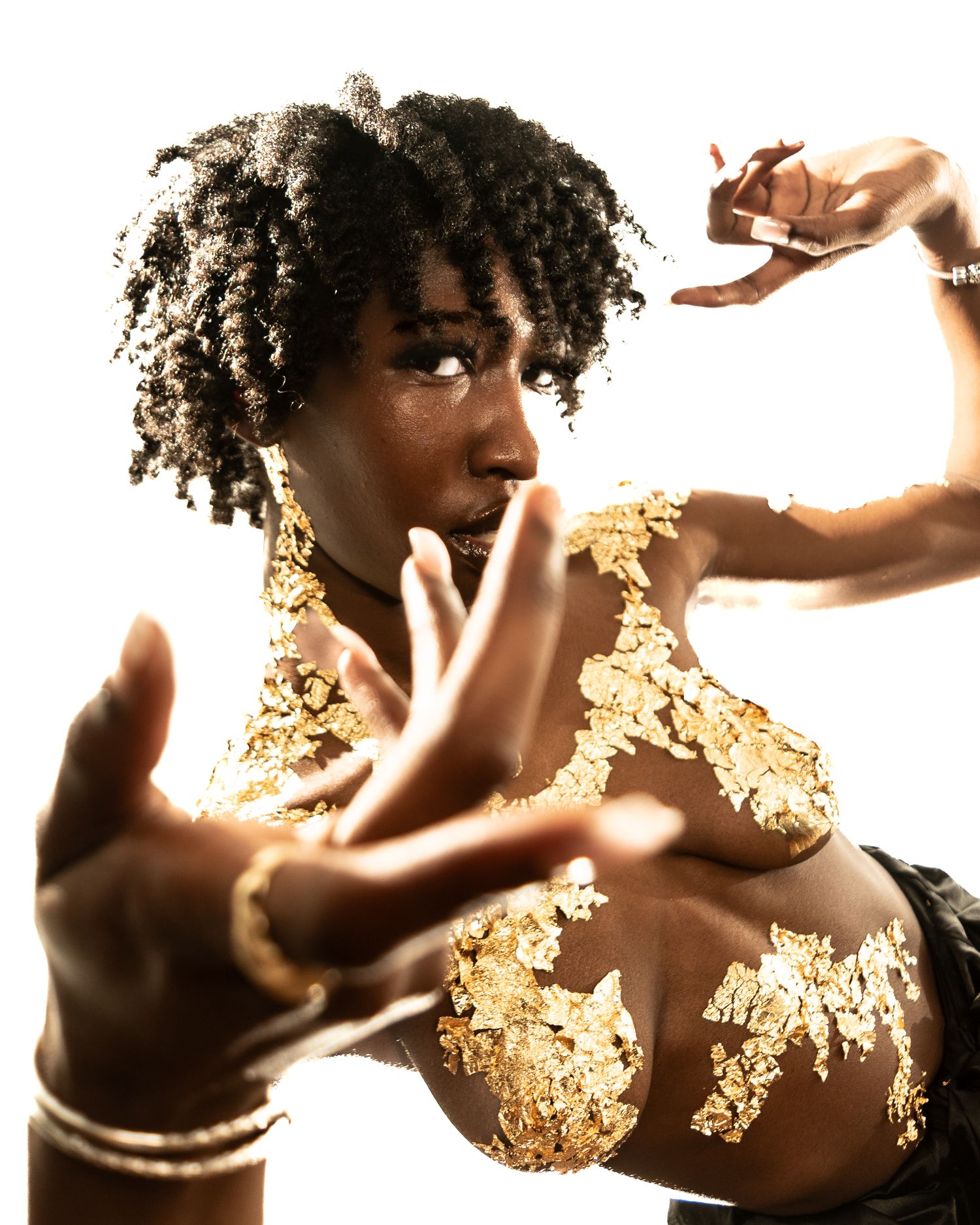 Dynamic dance movements with gold details shown in sequential frames.