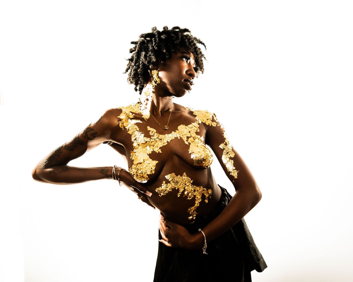 Artistic dance sequence with gold elements