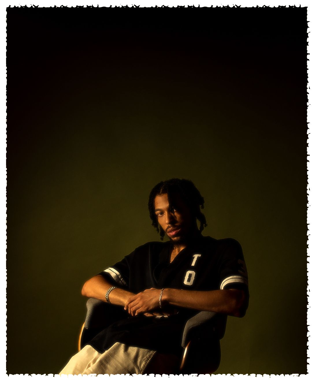 Artistic portrait series with dramatic side lighting against dark background.