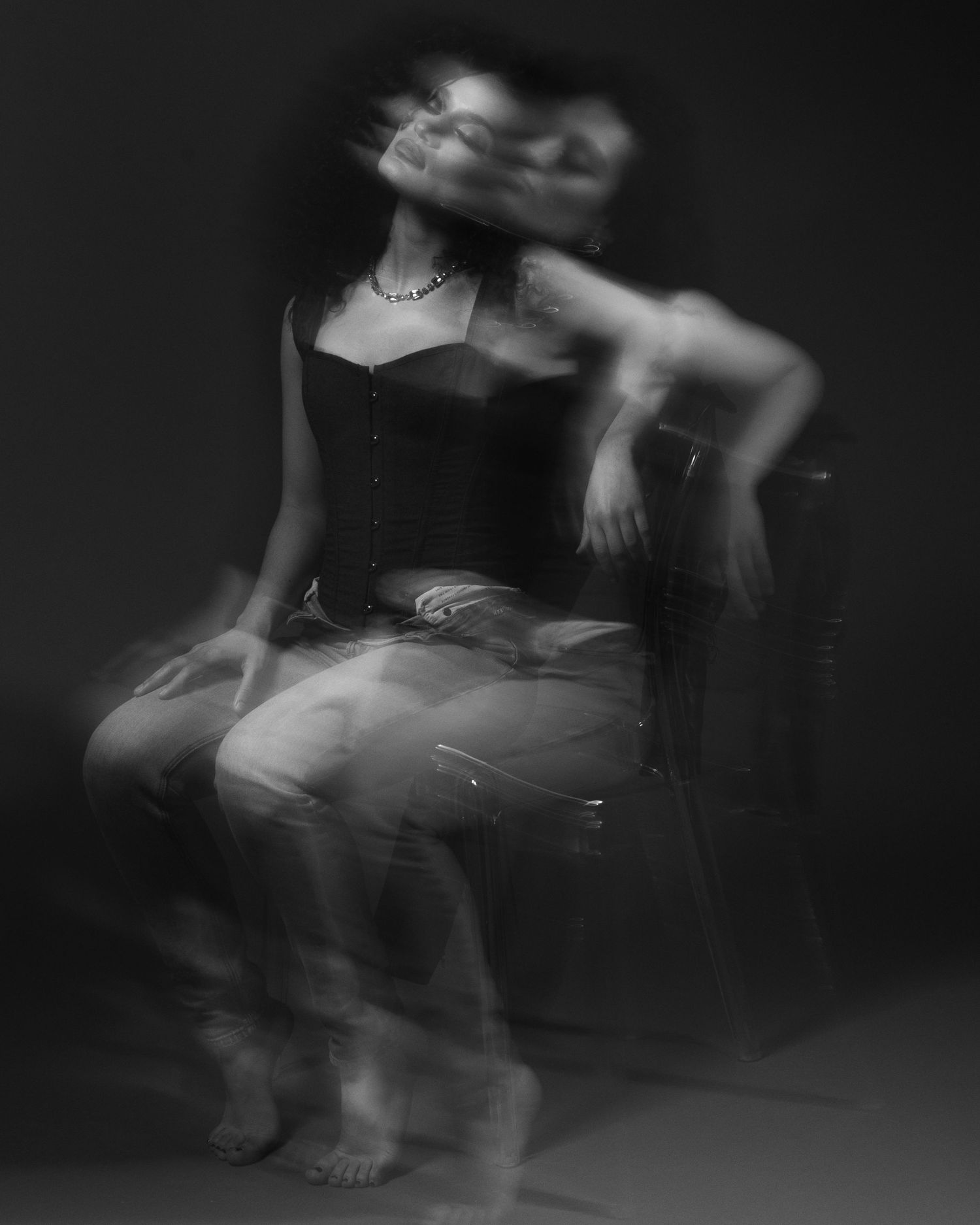 Abstract black and white motion blur captures dynamic movement on stage.
