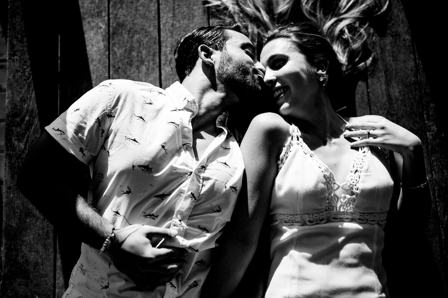 A series of black and white romantic photographs showing intimate moments between couples in an artistic style.