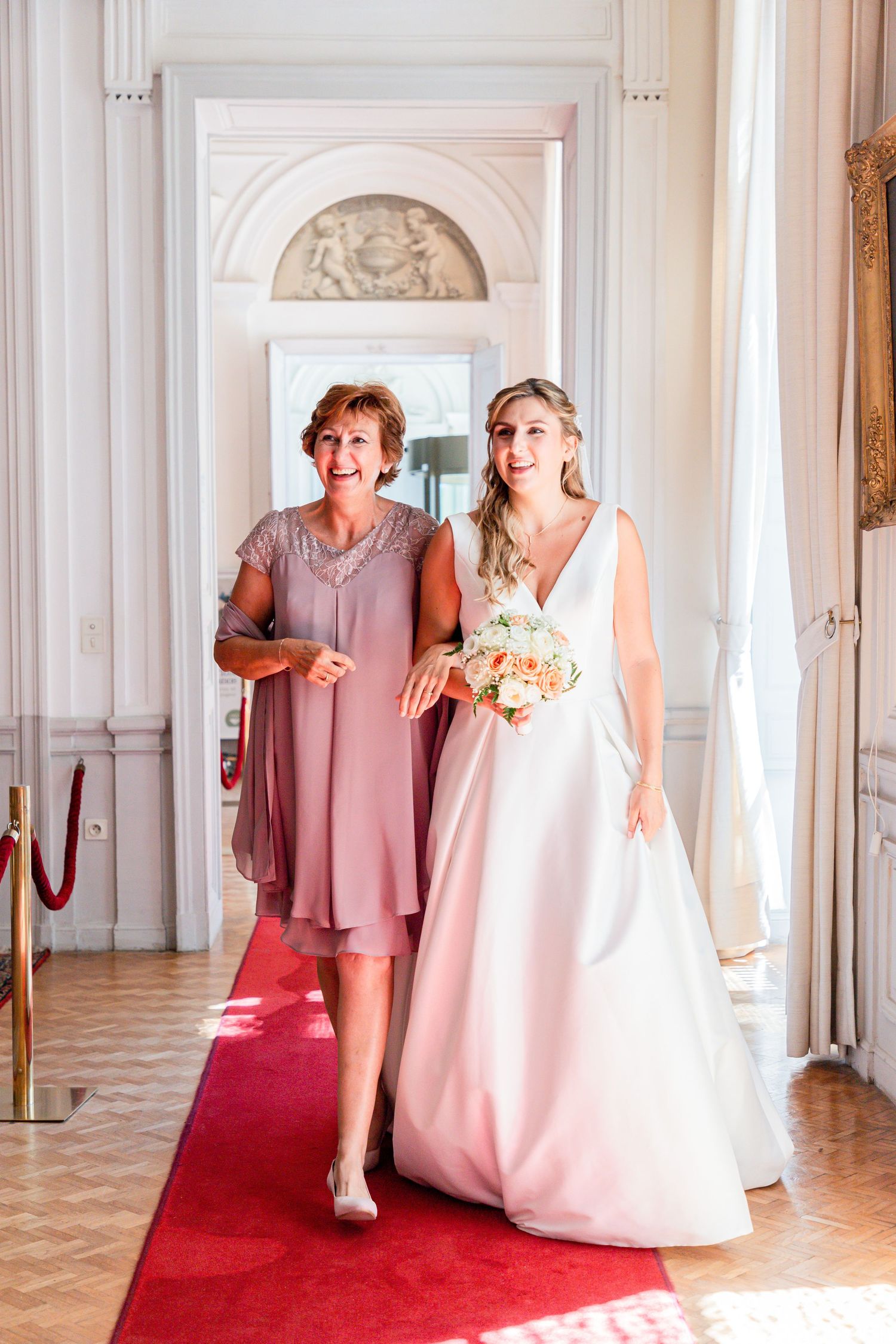 Wedding photos in an elegant white room with red carpet showing preparations.