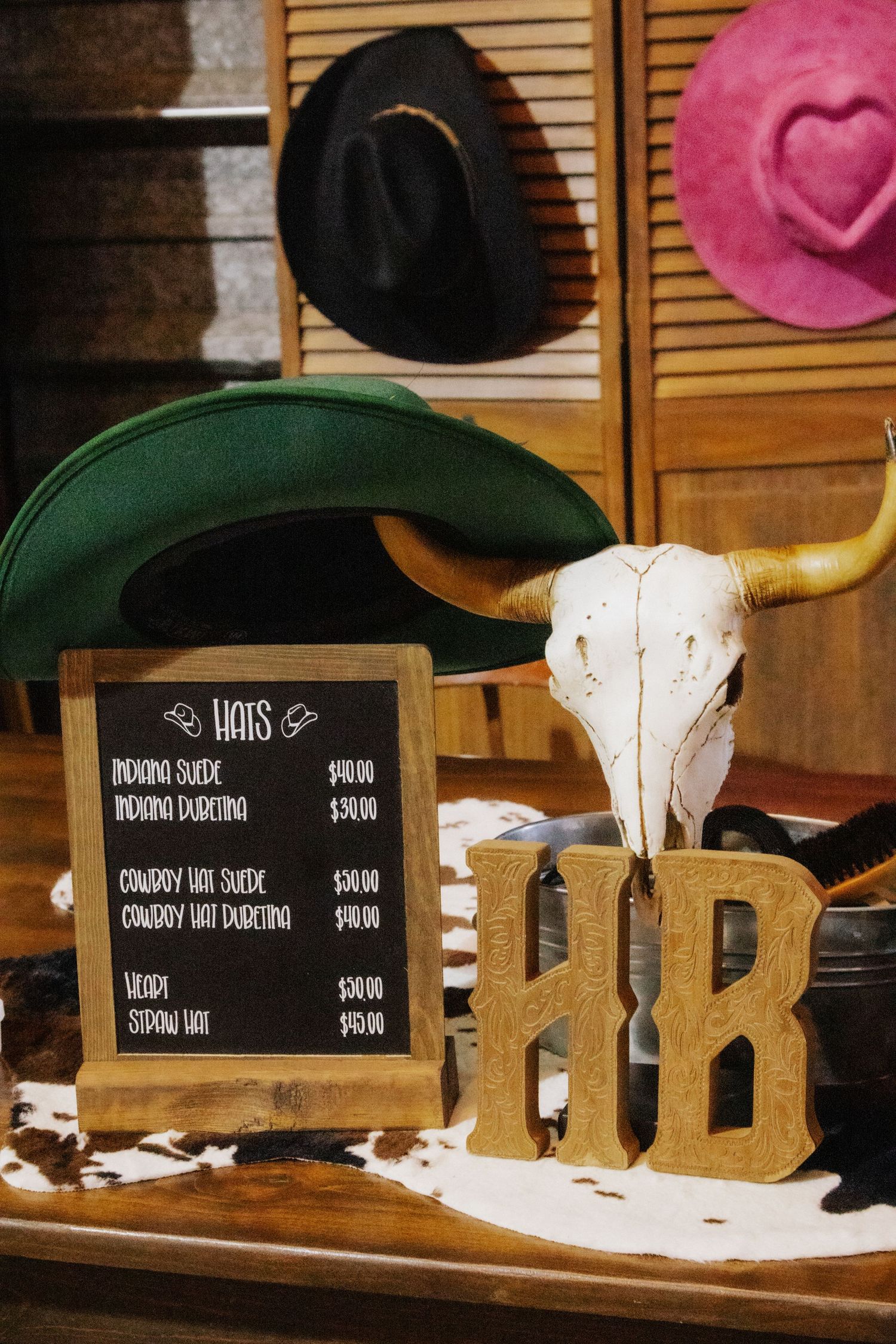 Western-themed display with cow skulls, wooden letters, and price signs.