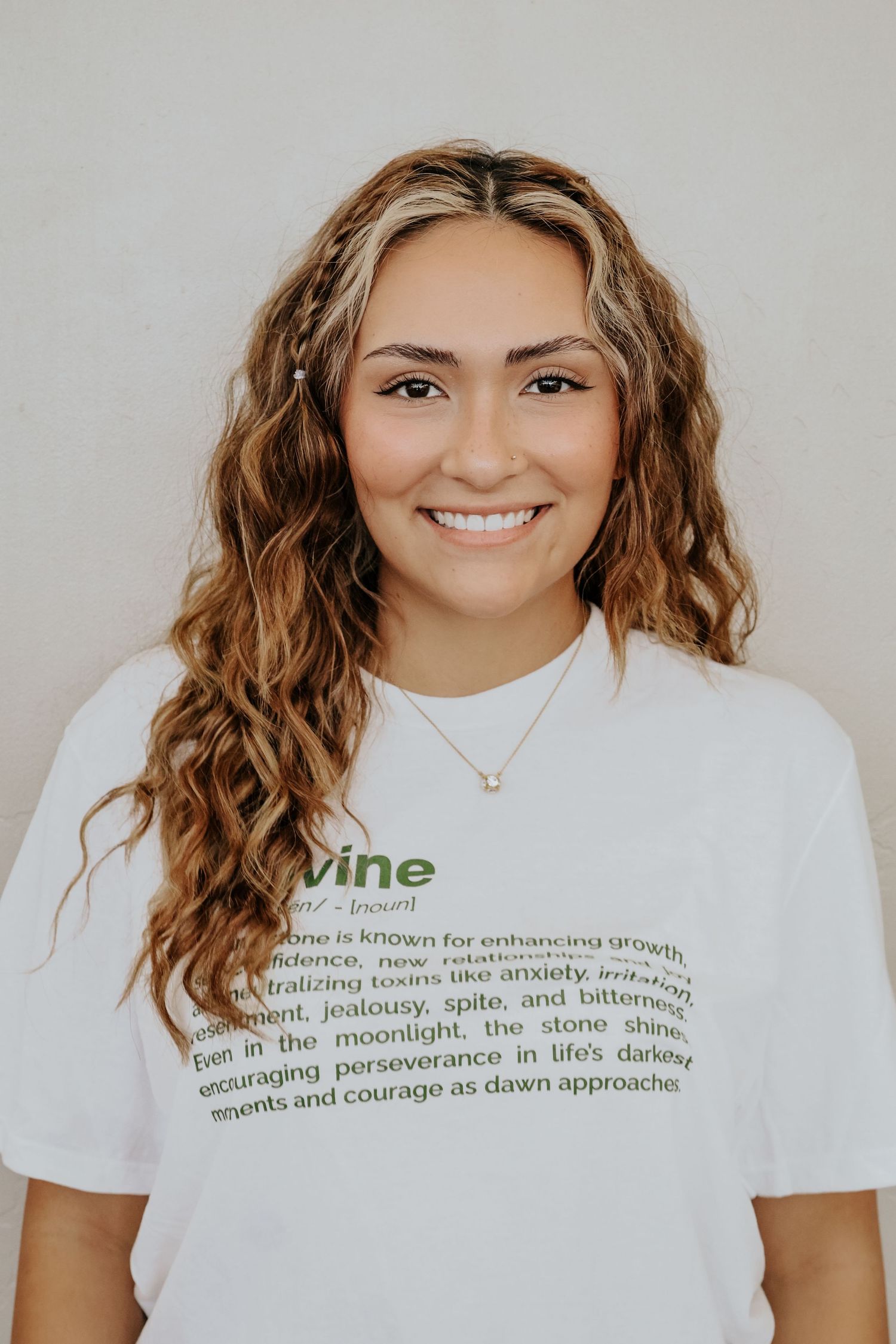 White t-shirt with green text design displayed in multiple angles.