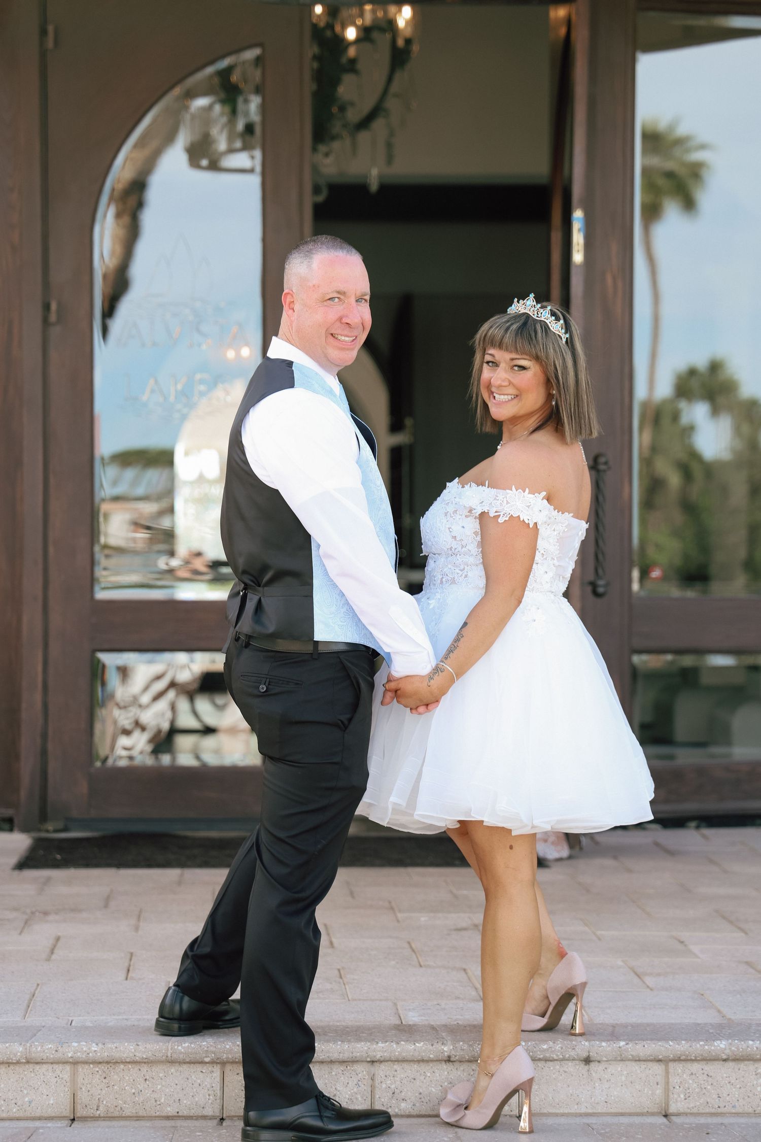 A series of wedding photos showing a couple dancing and twirling in formal attire on a stone patio.
