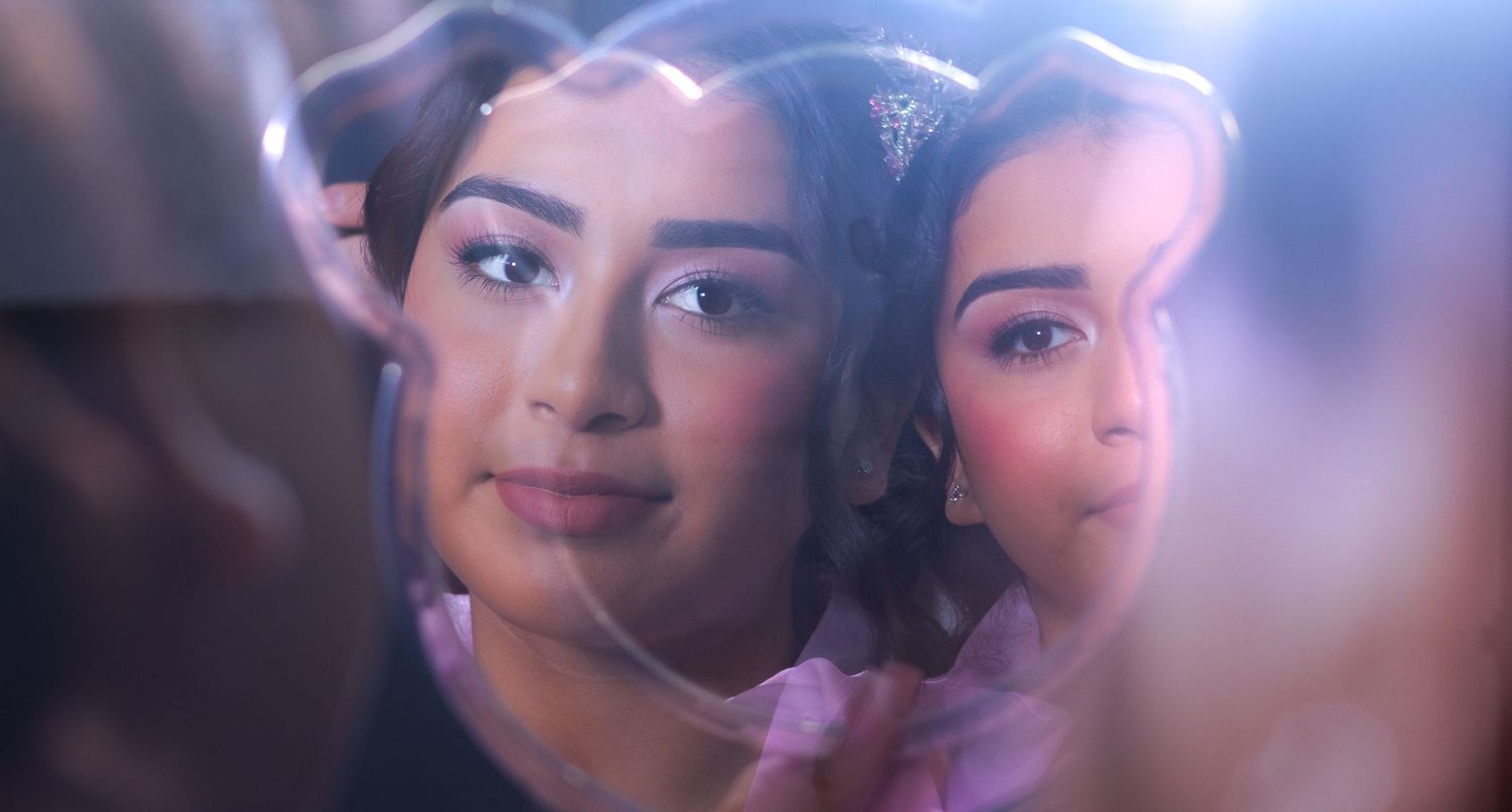 Close up beauty shots with soft lighting and makeup application in progress. At a Quinceañera