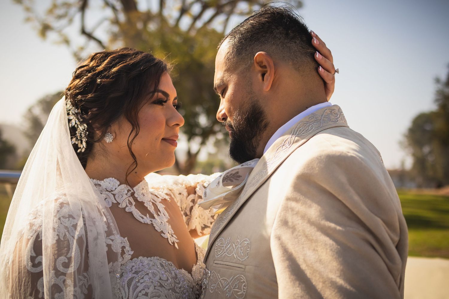 Intimate wedding portraits captured in warm natural lighting outdoors. At San Luis Rey Parish celebrating a wedding