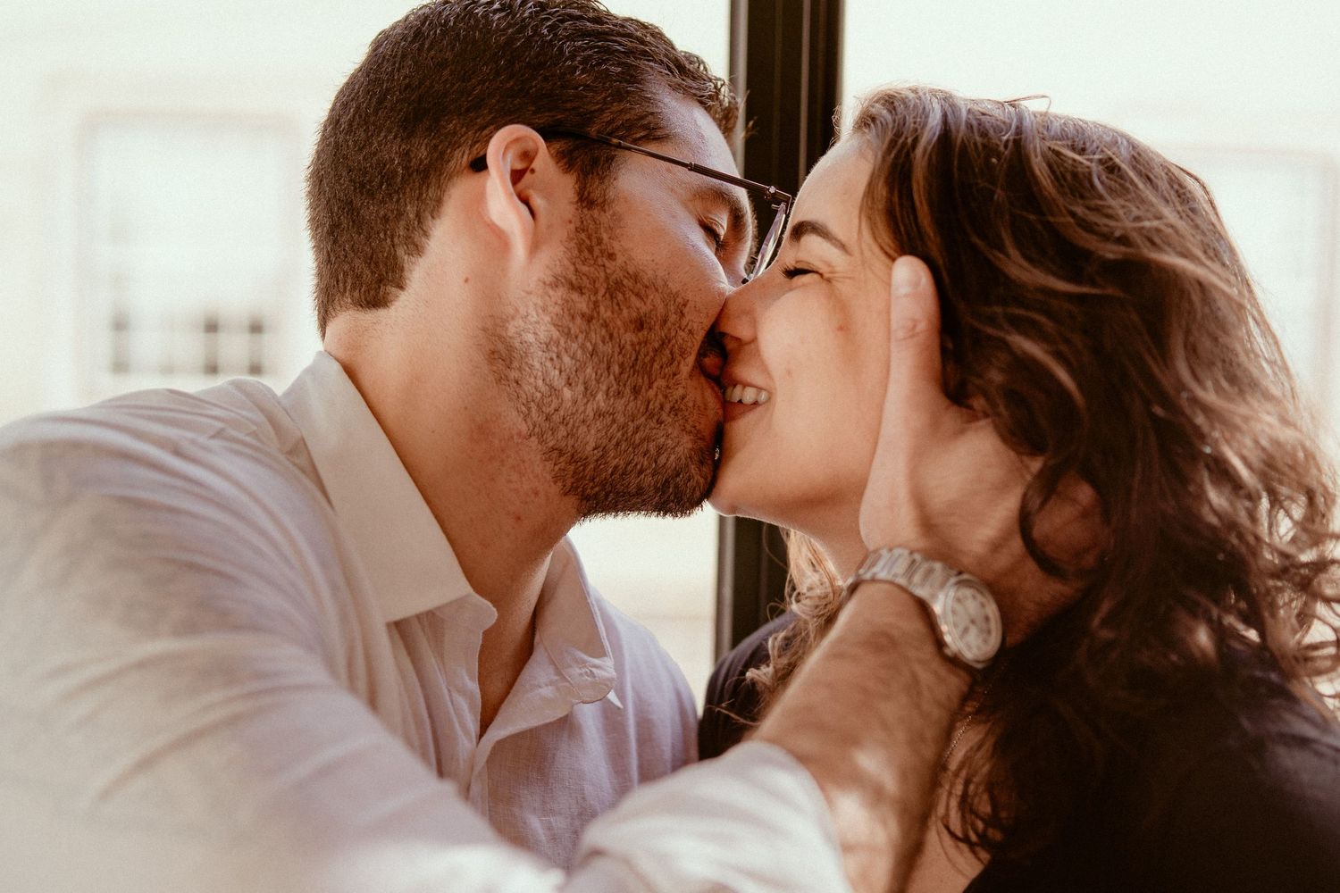 Romantic couple sharing tender moments together in a series of intimate black and white photographs.