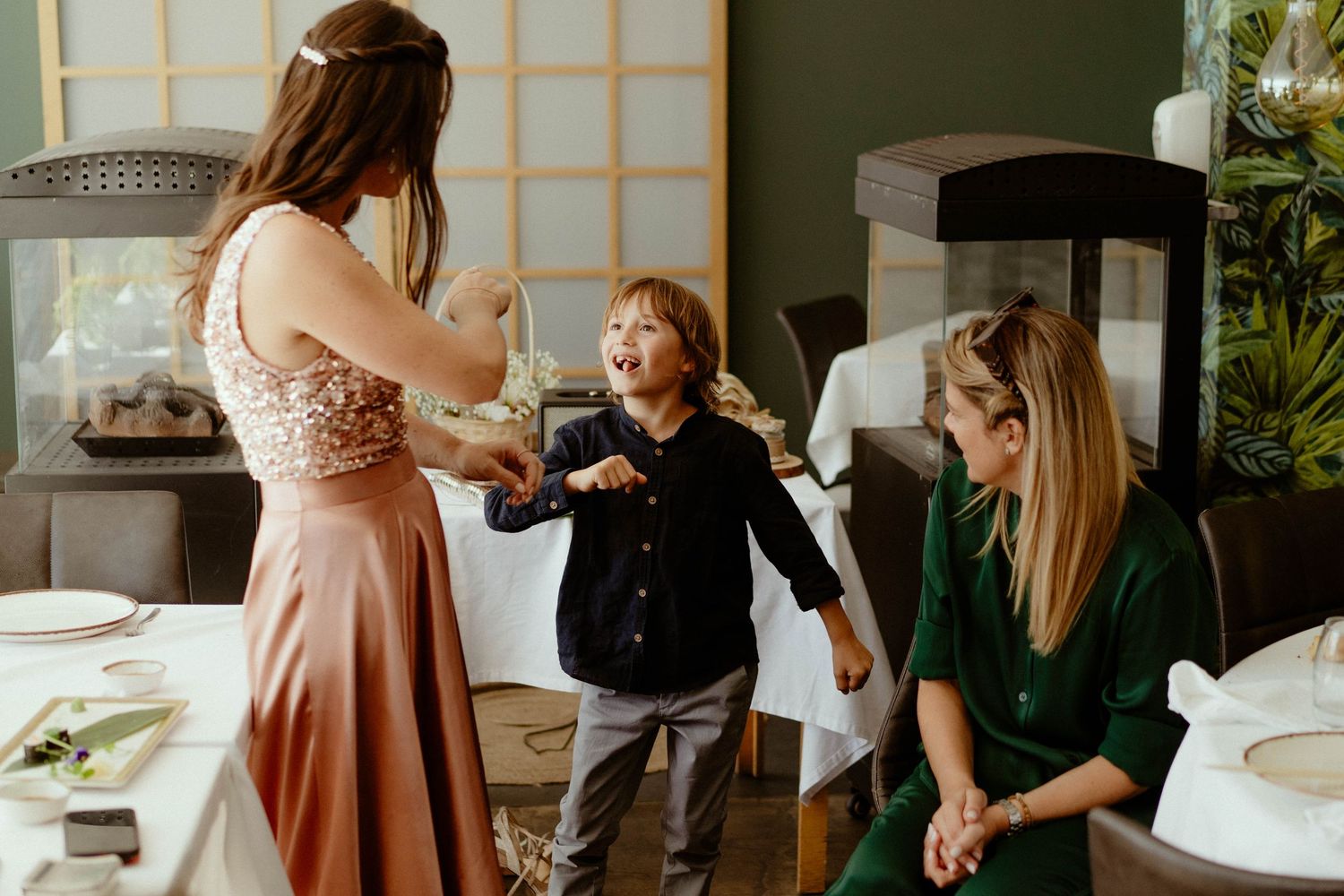 A series of wedding preparation moments showing dress fittings, styling, and candid interactions in a bridal suite.