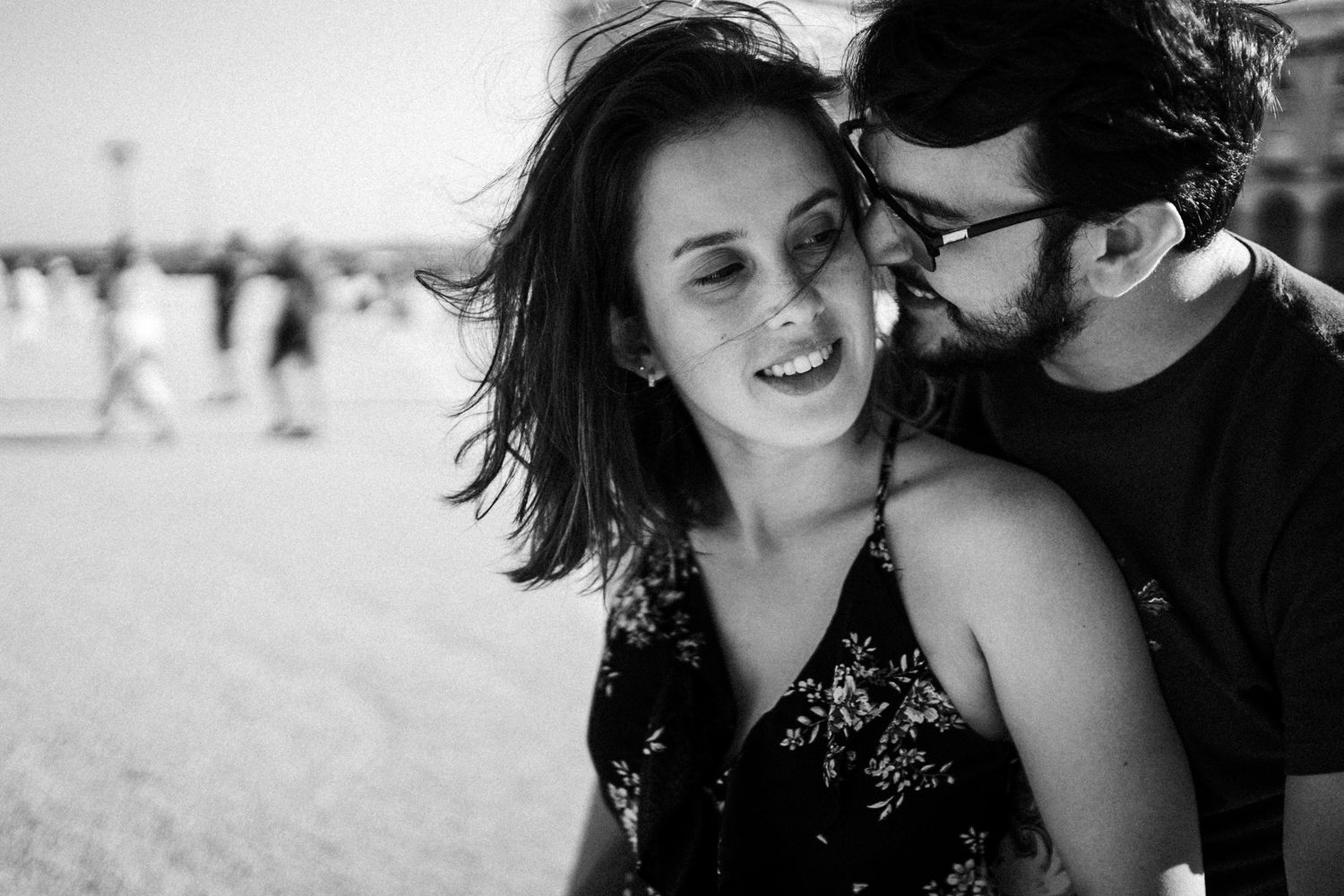 A black and white candid moment captured at the beach.