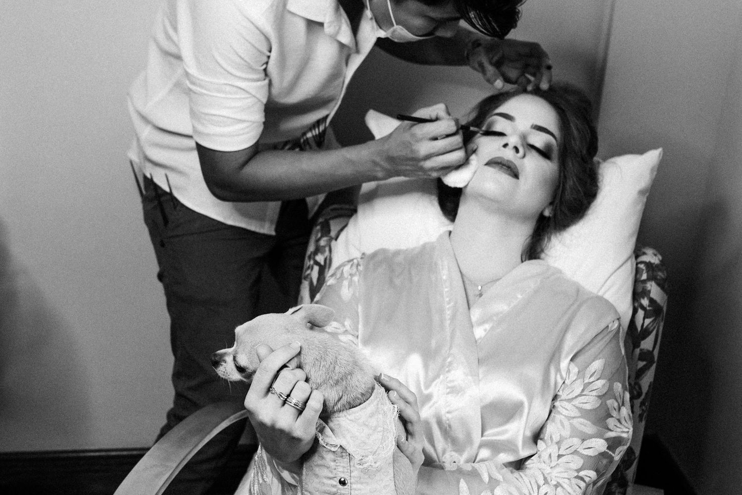 A series of black and white images showing dental treatment procedures being performed in a clinical setting.