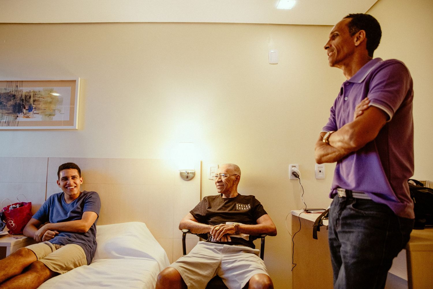 Group meeting in casual setting with natural lighting in a simple room.