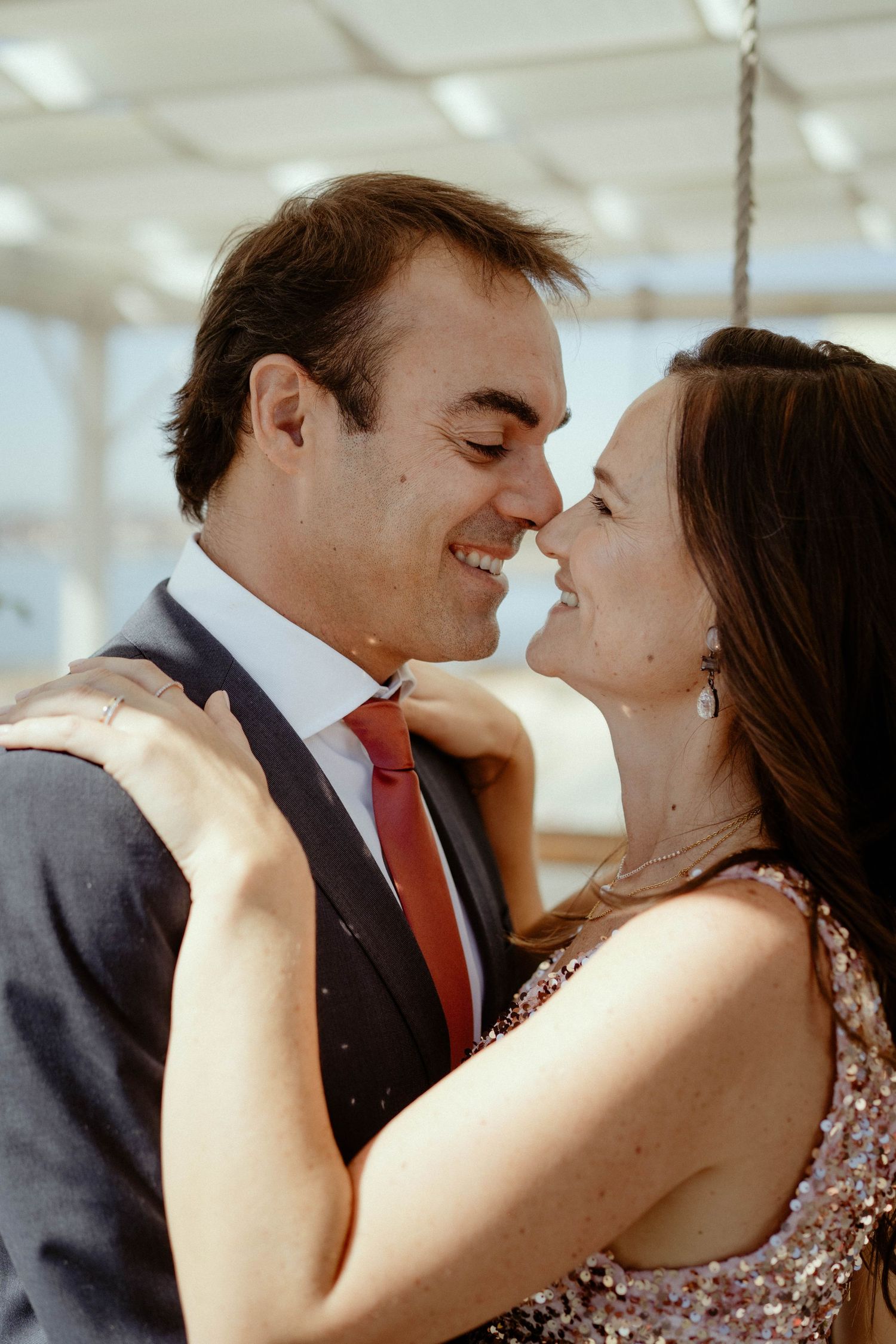 A romantic sequence of photos shows a couple in formal attire sharing an intimate moment together.