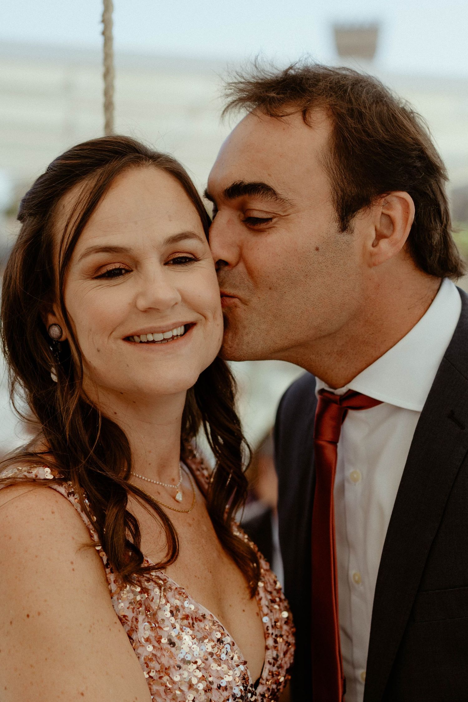 A romantic sequence of three photos showing a couple sharing tender moments in formal attire.
