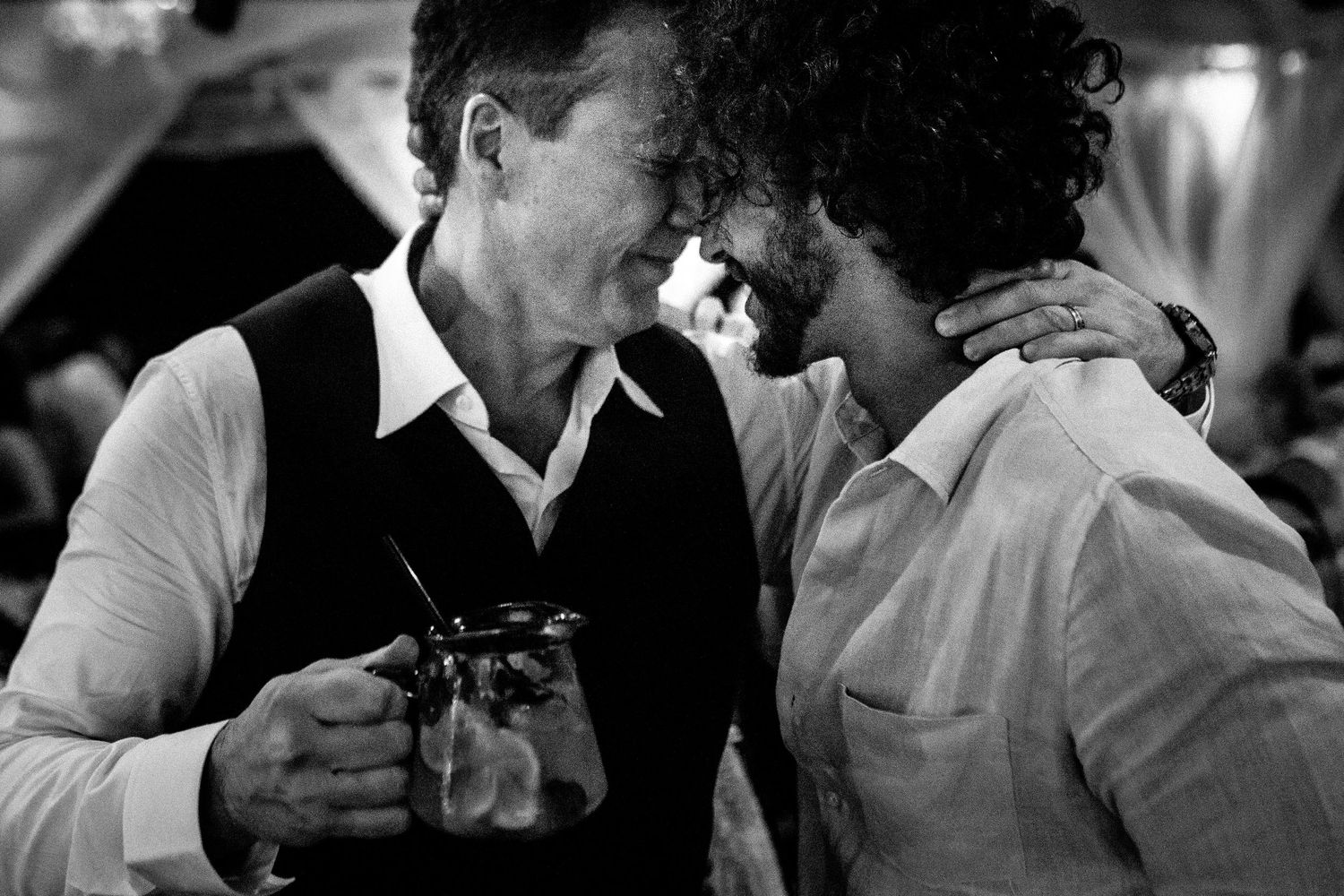 Black and white candid shots of wedding reception moments.