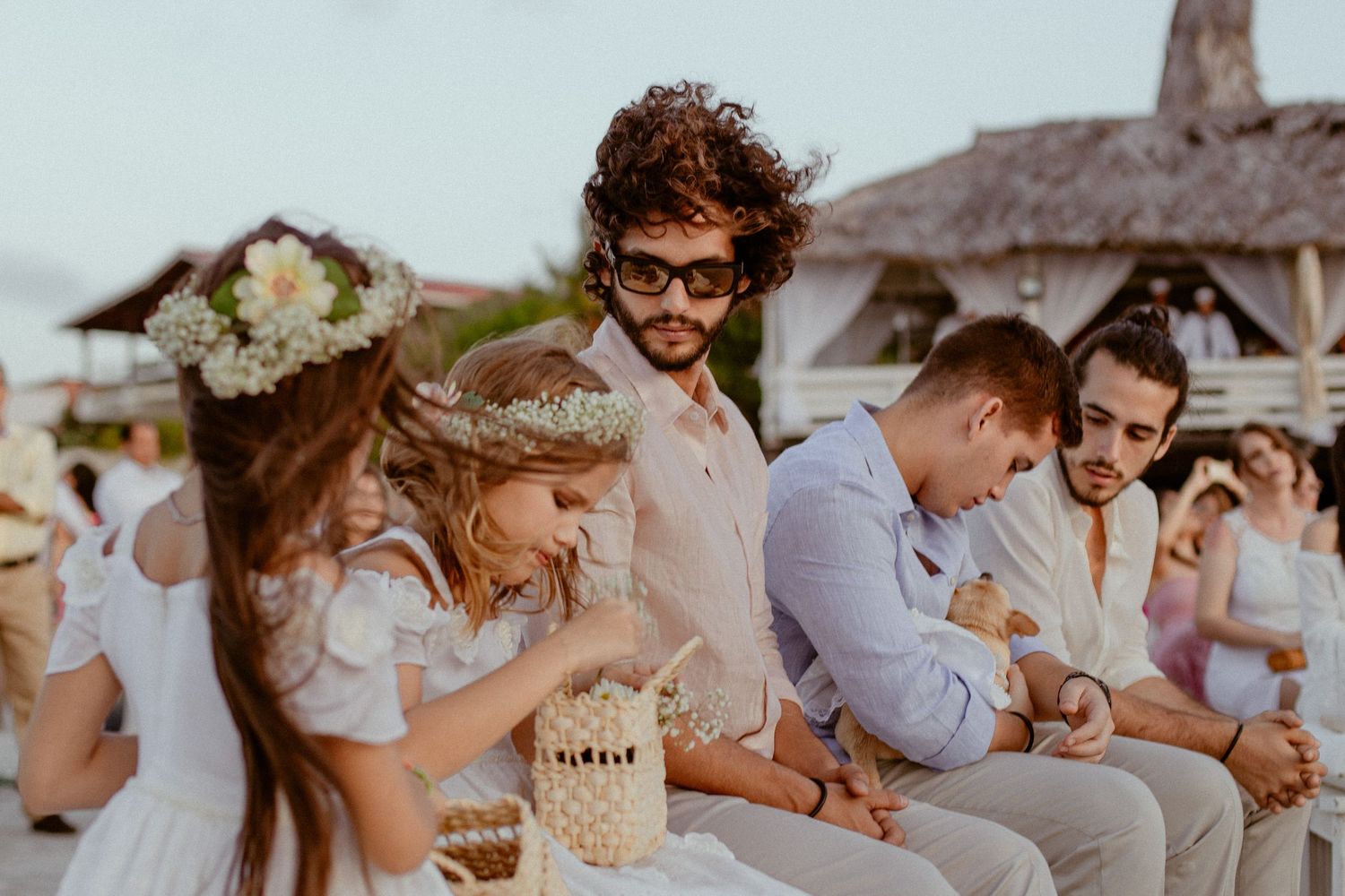 A collage of wedding celebration moments showing couples and guests enjoying outdoor festivities at sunset.