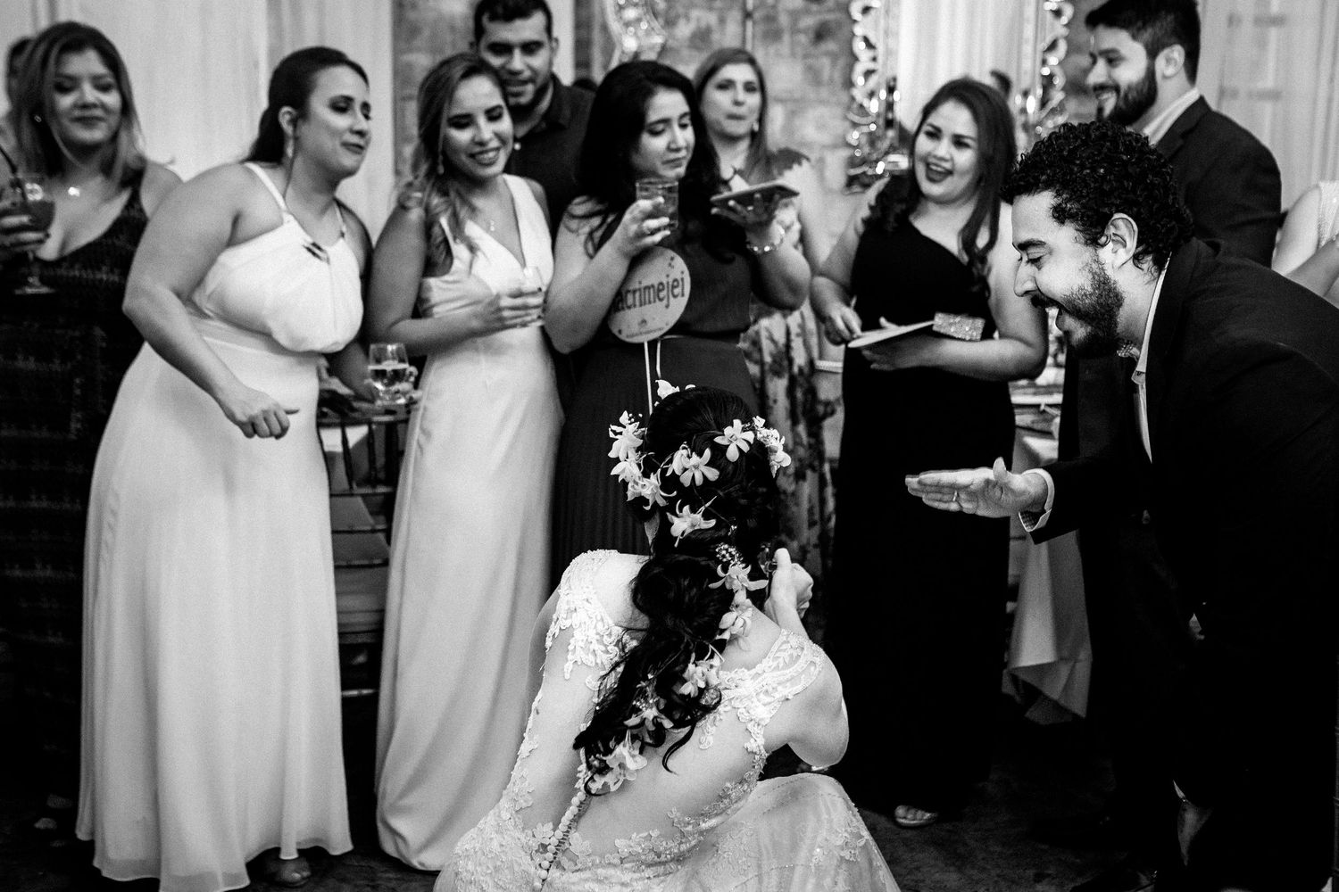 Black and white photo of wedding celebration with bridal party.