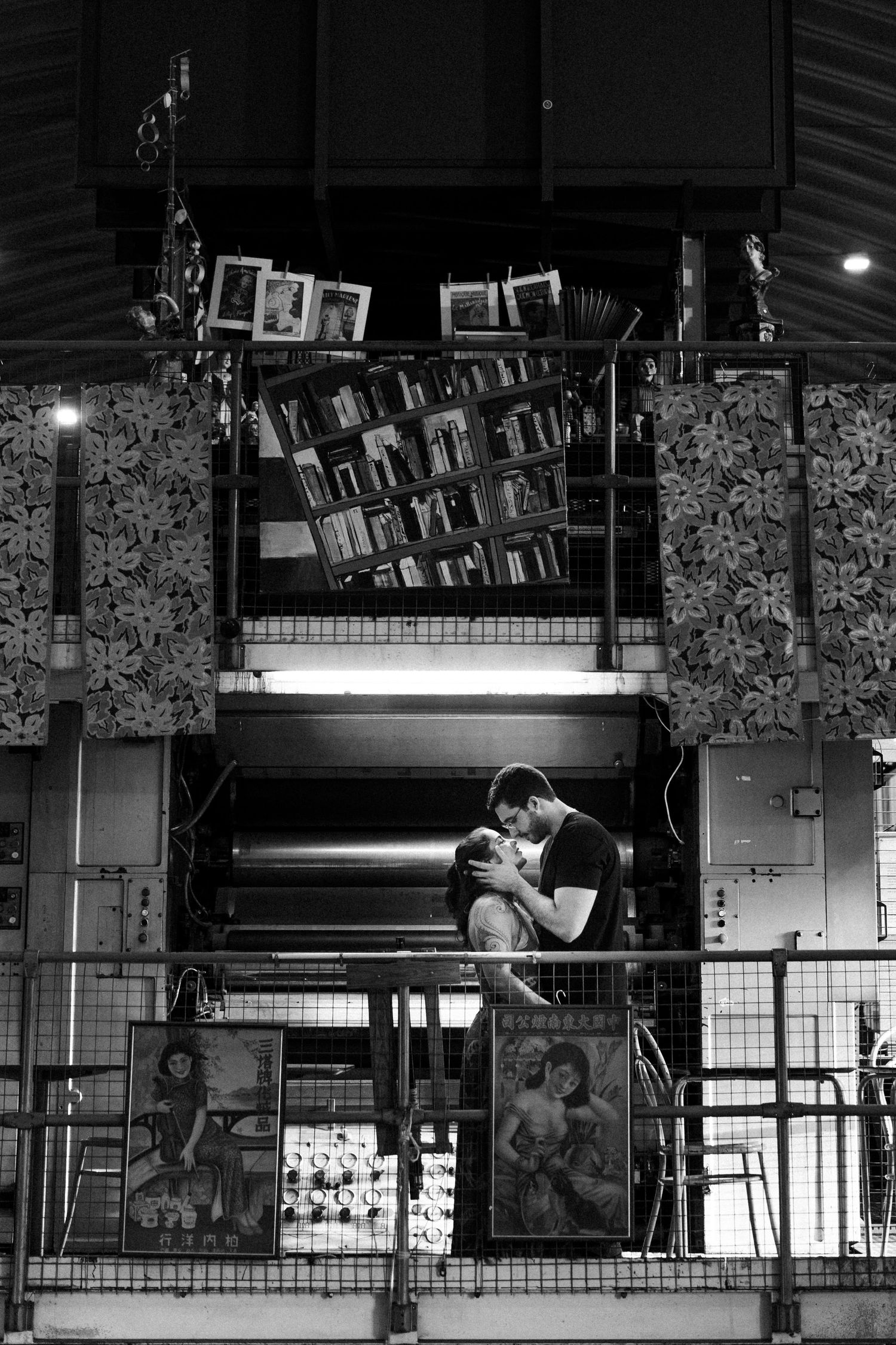 A sequence of black and white photos showing silhouettes of people interacting through a glass window design.
