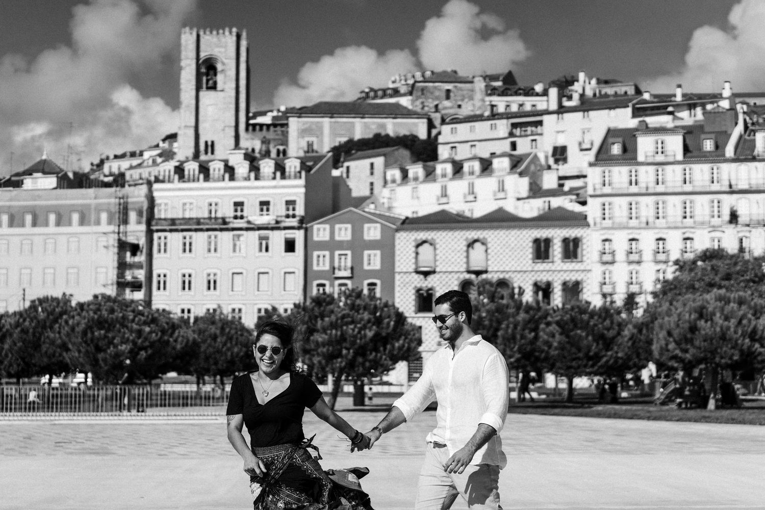 A black and white panoramic collage of seaside buildings shows a coastal town with Victorian architecture and streetscapes.