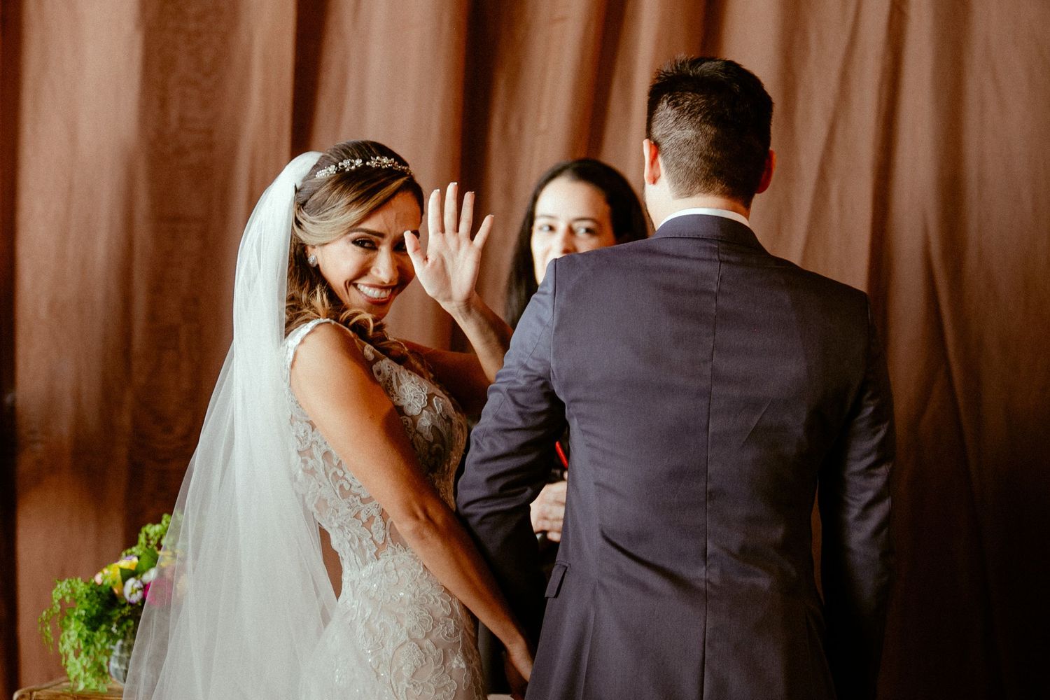 A couple shares intimate wedding moments in a series of romantic sepia-toned photographs.