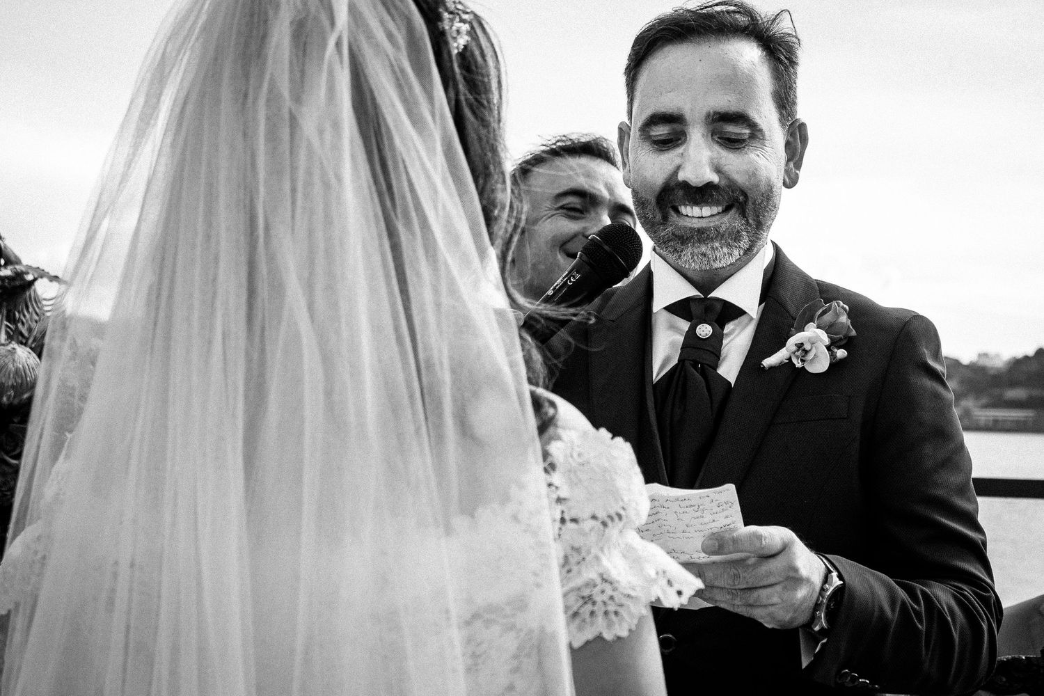 Candid moment during wedding vows showing emotional exchange between couple.