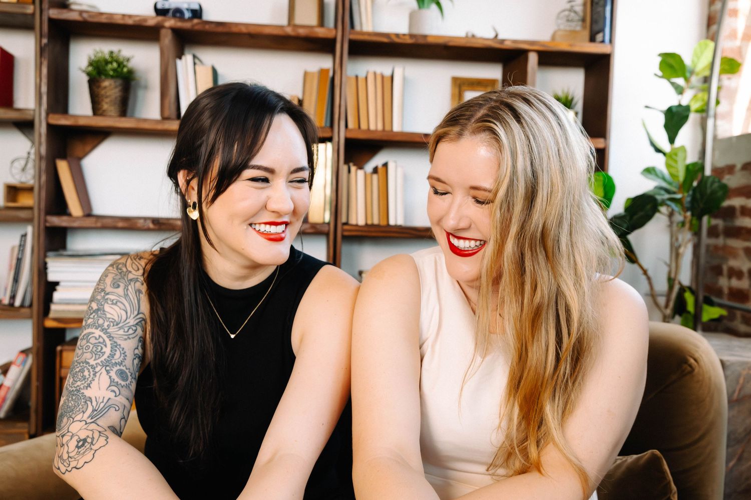 Joyful creative female team, two LA women laughing for editorial personal branding portraits in Los Angeles, by phia photography.