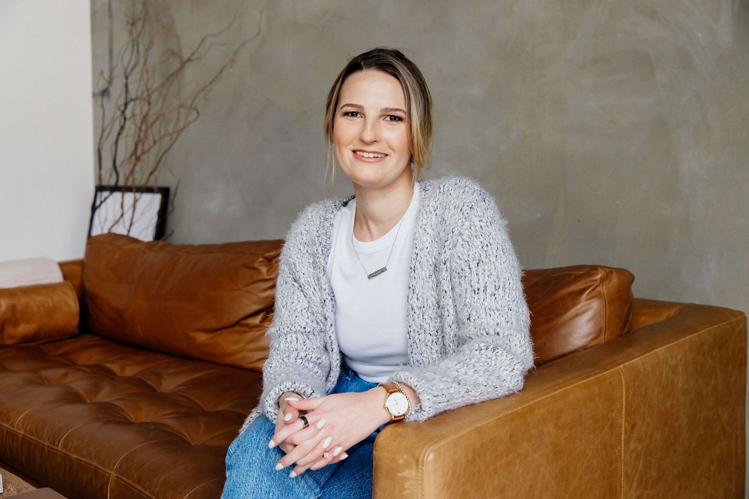 Creative natural light personal branding portraits of wellness professional woman on couch by Los Angeles photographer Phia Photography.