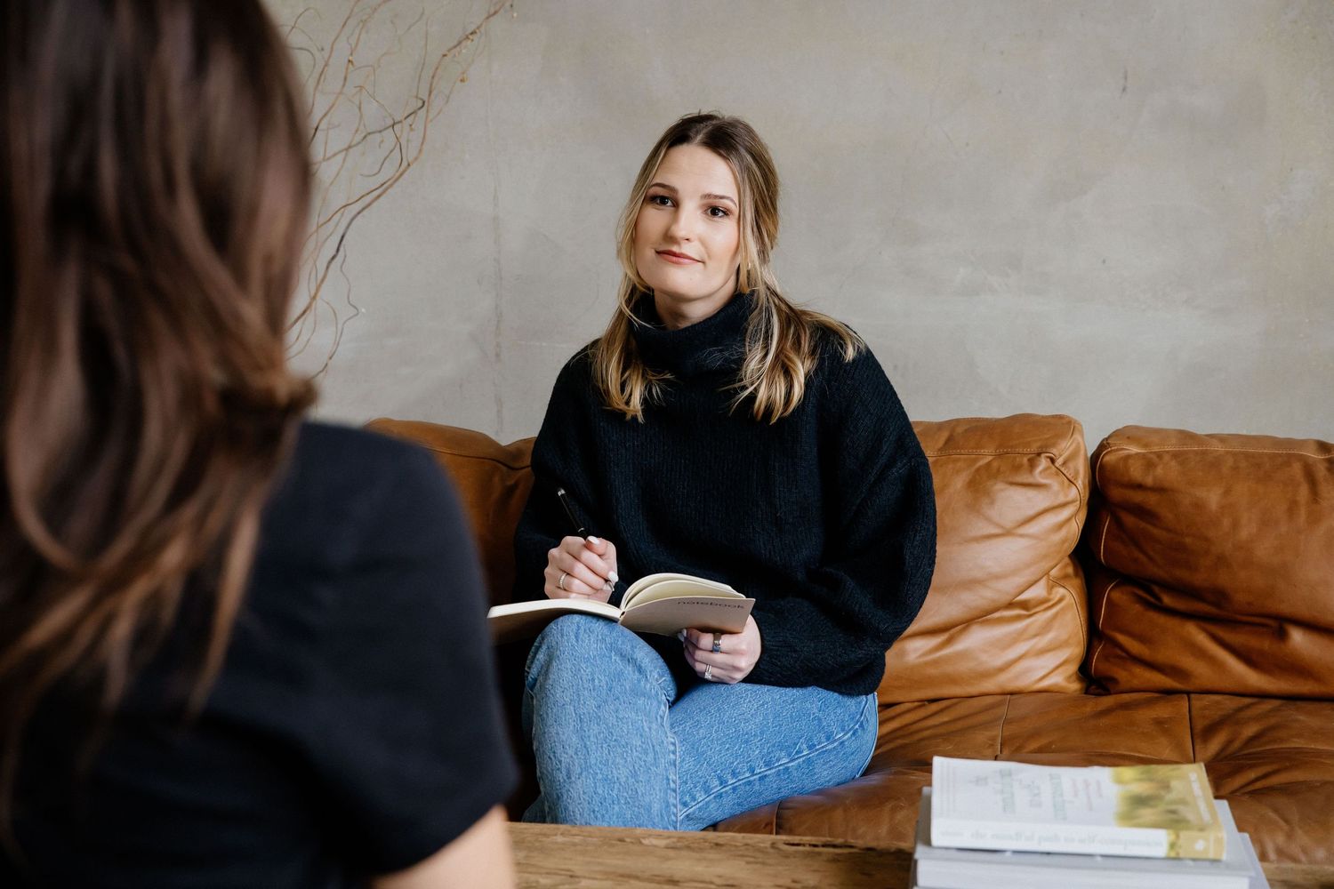 Creative natural light personal branding portrait of therapist woman in Los Angeles office by photographer Phia Photography.