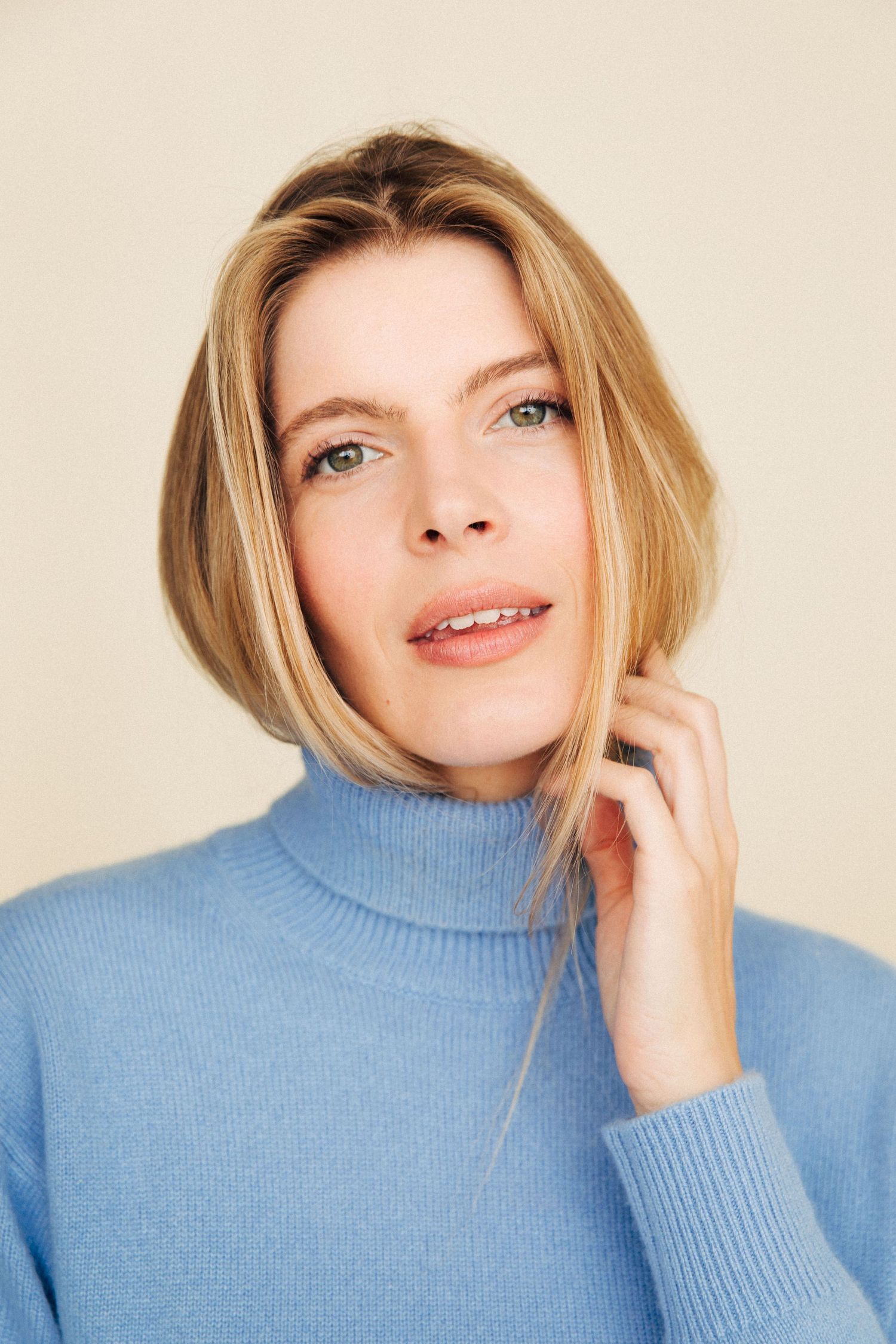 Creative linkedin headshots of female actor, Los Angeles woman wearing blue shirt in Santa Monica photo studio, by Phia Photography.