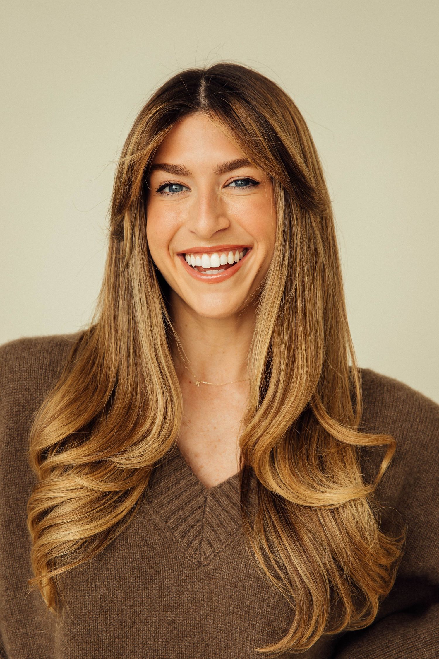 Creative natural light headshot of smiling woman influencer and speaker for personal branding in Los Angeles studio by Phia Photography.
