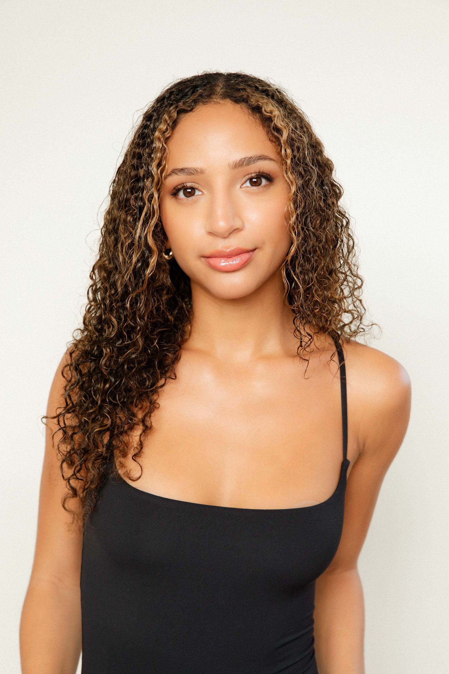 Beginner model portfolio headshot for ageny portraits of a Black woman in a Santa Monica studio by LA photographer Phia Photography.