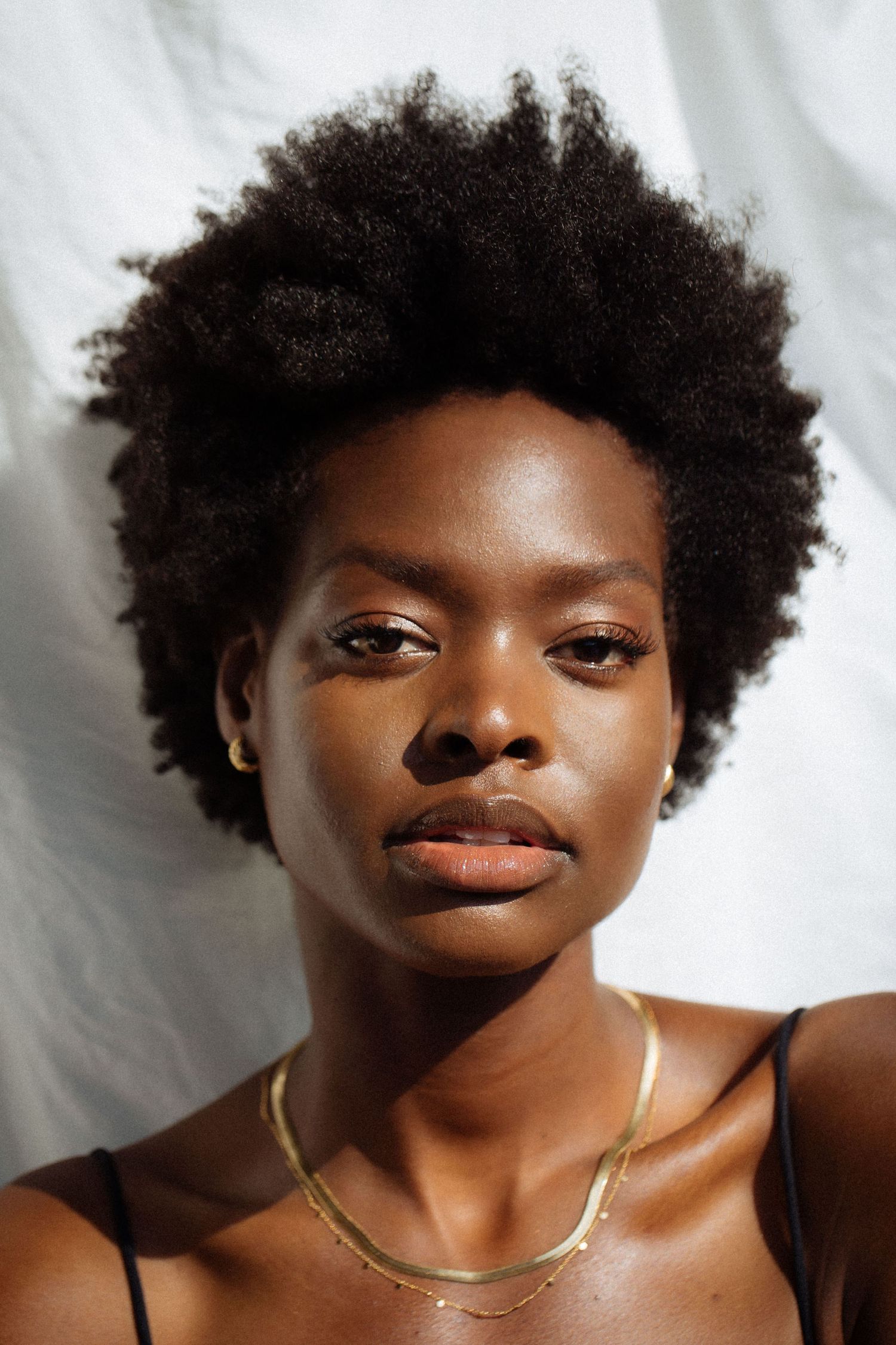 Editorial natural light model portfolio headshot of beautiful Black woman by Los Angeles photographer Phia Photography.