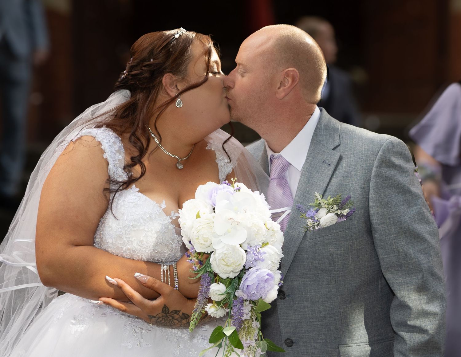 Newly married couple outside Dukinfield Register Office after their wedding ceremony