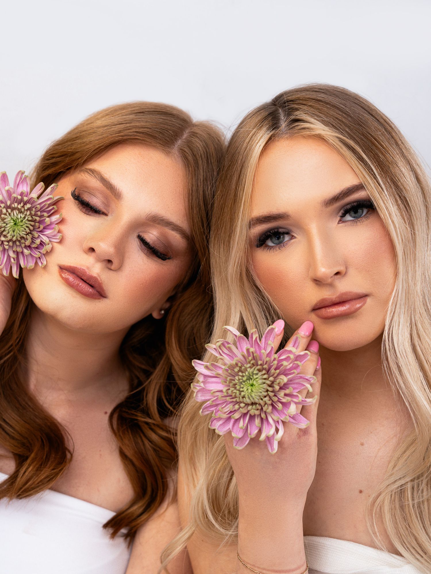 Artistic beauty series with pink chrysanthemum flowers showing various makeup looks.