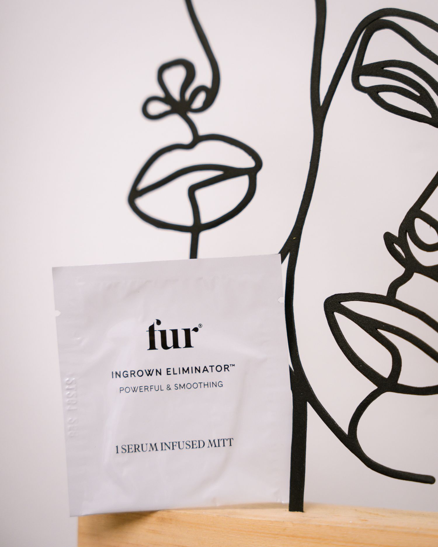Black line art illustrations and text on white product packaging.