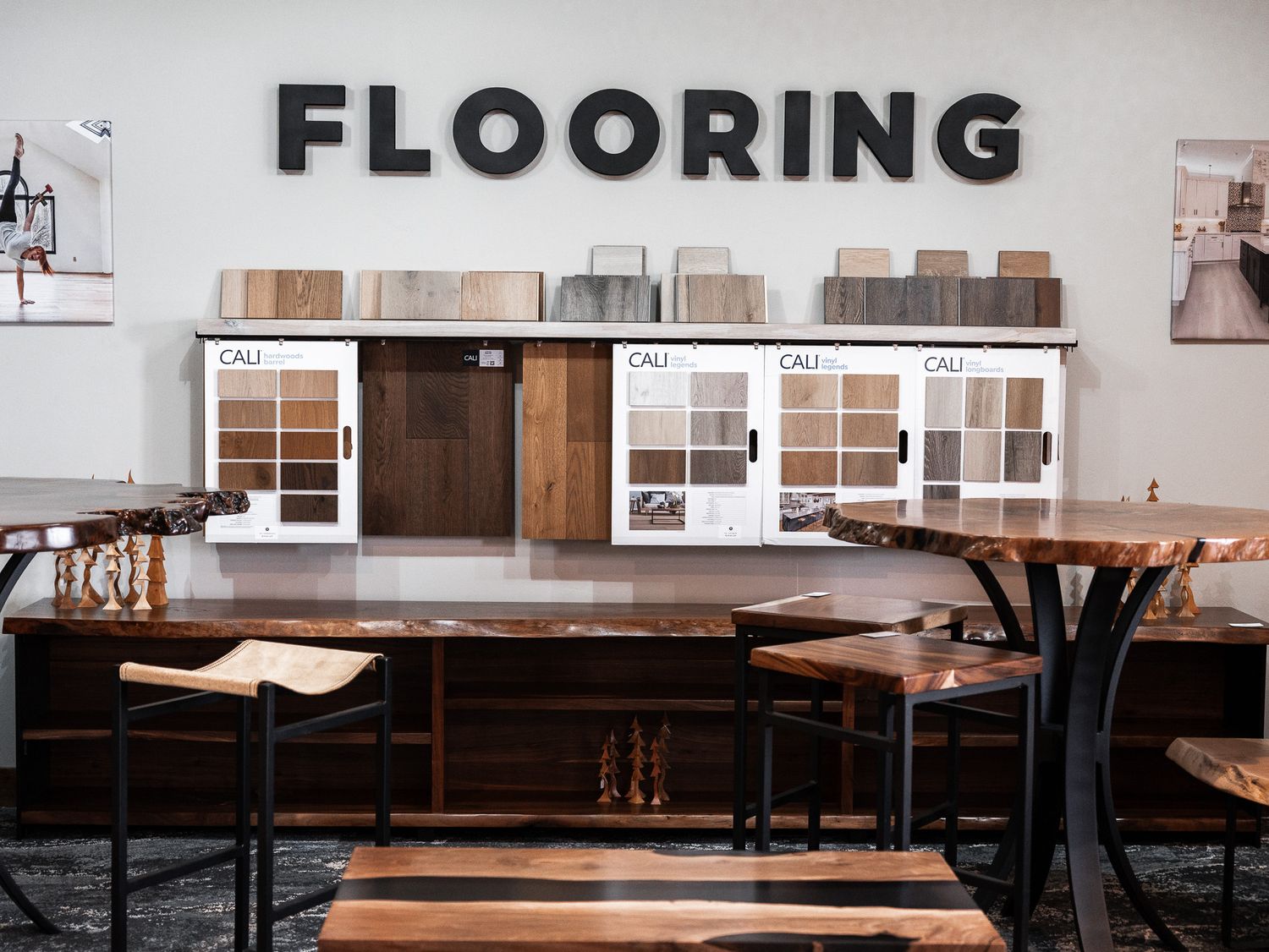 Flooring showroom interior displaying various wood samples and materials.