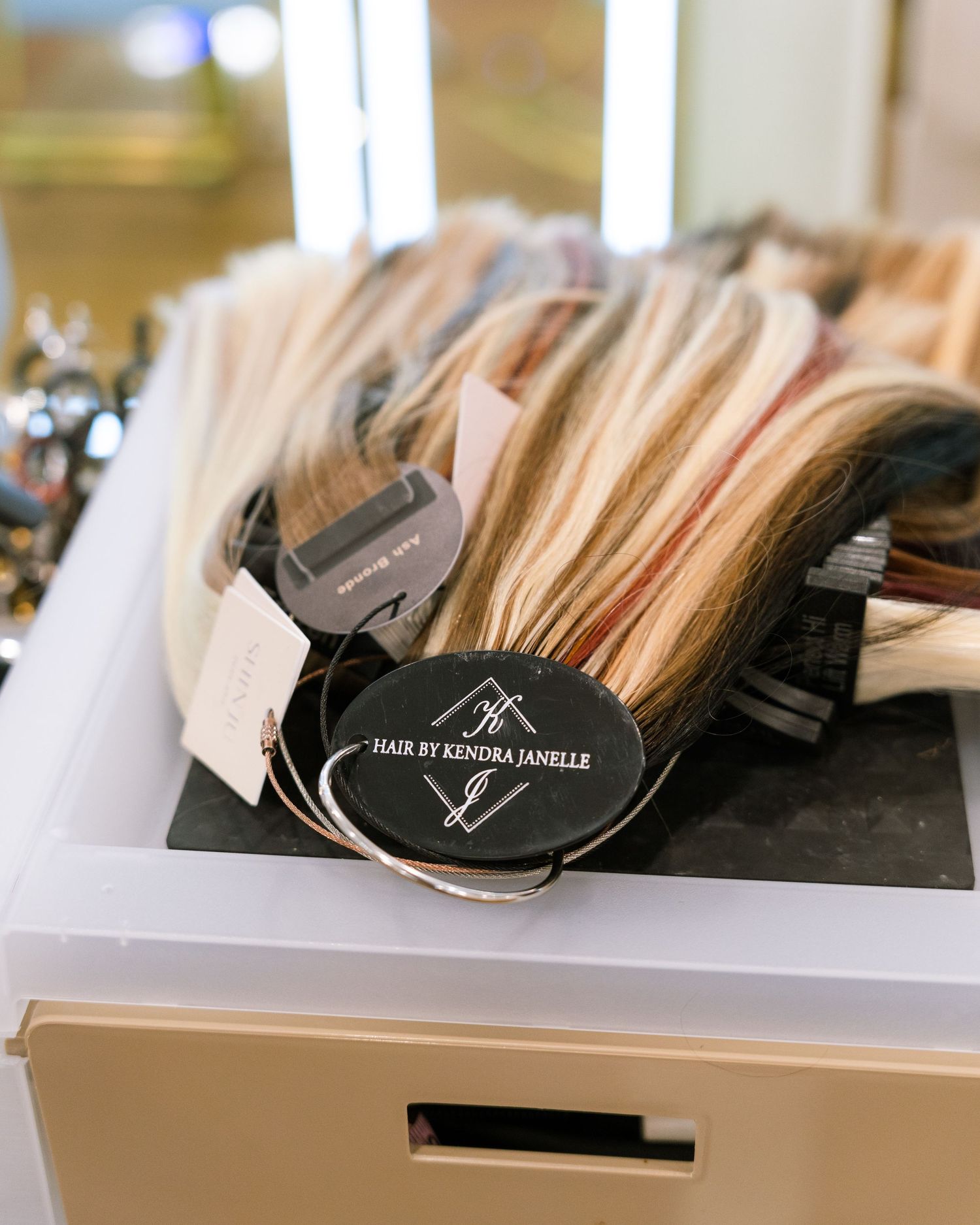 Hair extension samples and color swatches organized in a product display.