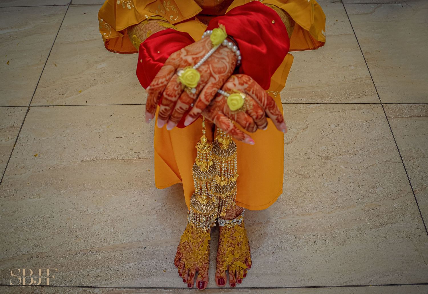 Traditional Indian wedding attire with ornate gold jewelry and red sari details shown in close-up shots on tiled floor.