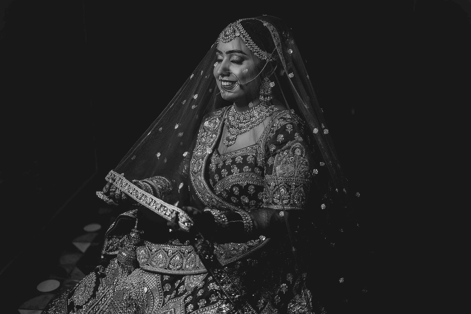 A collection of six black and white wedding photos showing traditional Indian bridal attire and jewelry.