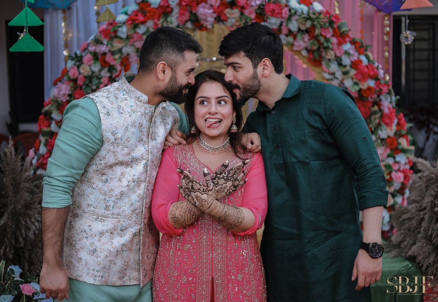 A series of candid moments captured at an Indian wedding celebration with pink floral decorations in the background.