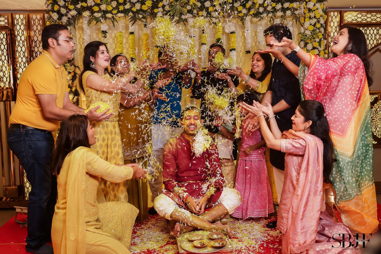Traditional Indian wedding ceremony with guests participating in cultural rituals and celebrations in vibrant attire.