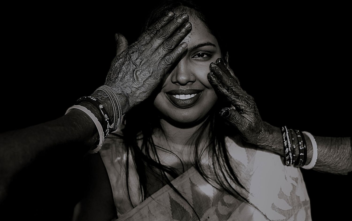 Moody black and white portraits with elegant jewelry and dramatic side lighting.