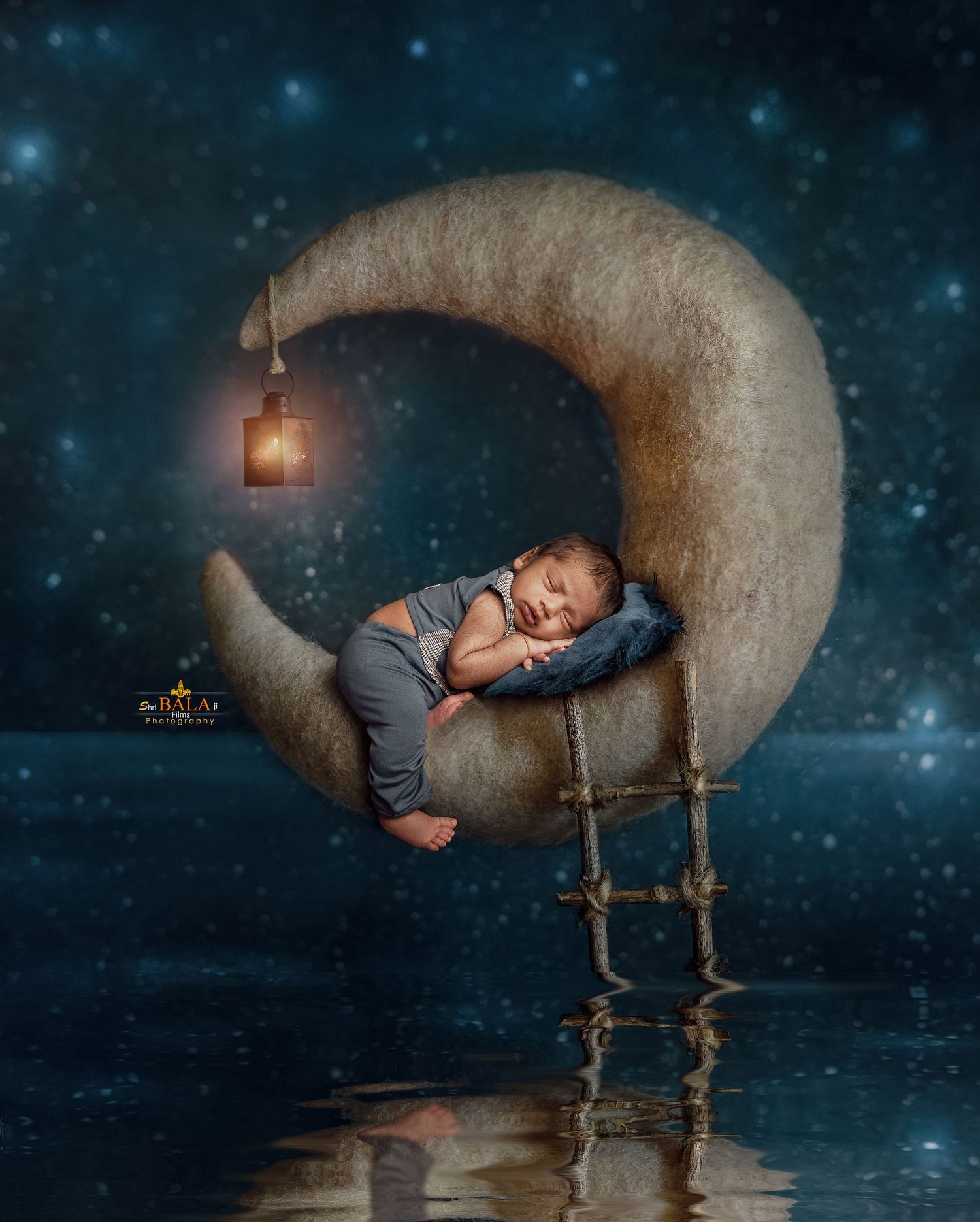 A dreamy nighttime scene shows a sleeping figure resting on a crescent moon prop with stars twinkling in the background.
