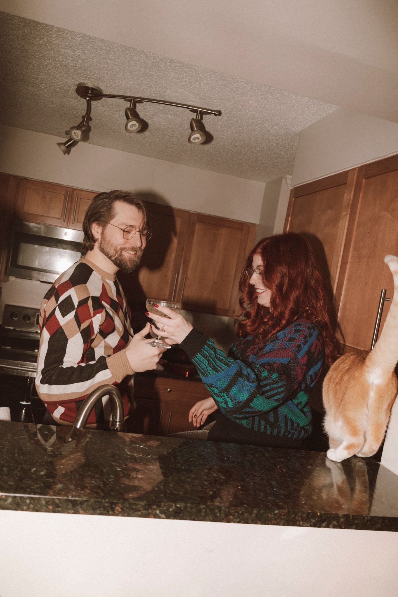 A sequence of photos showing people playfully interacting on a kitchen counter with dramatic lighting.
