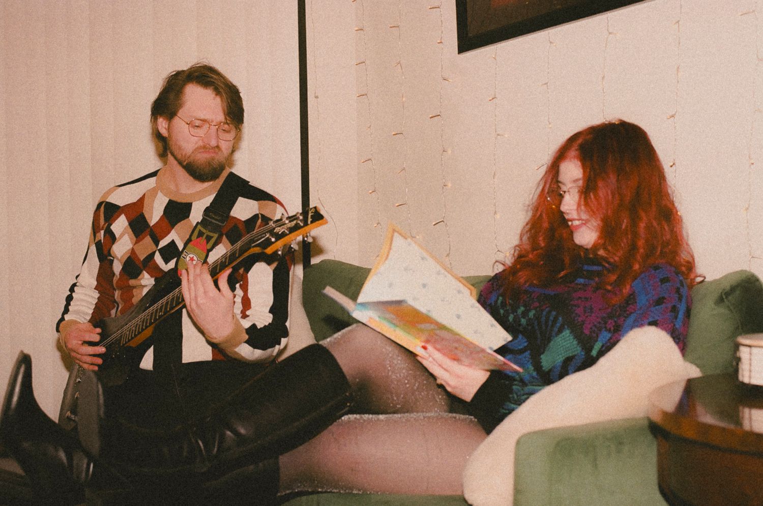 Musicians in a recording studio read from sheet music while performing together.