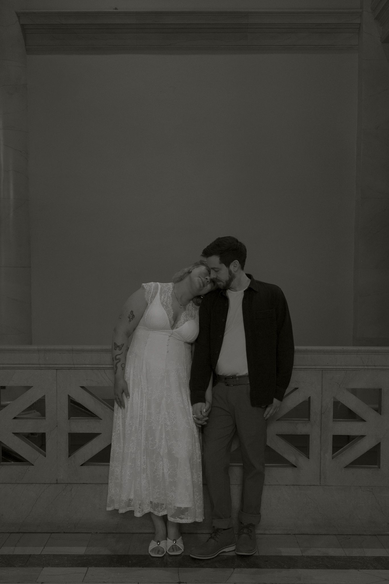 A romantic black and white photo sequence shows a couple embracing on a porch with white railings.